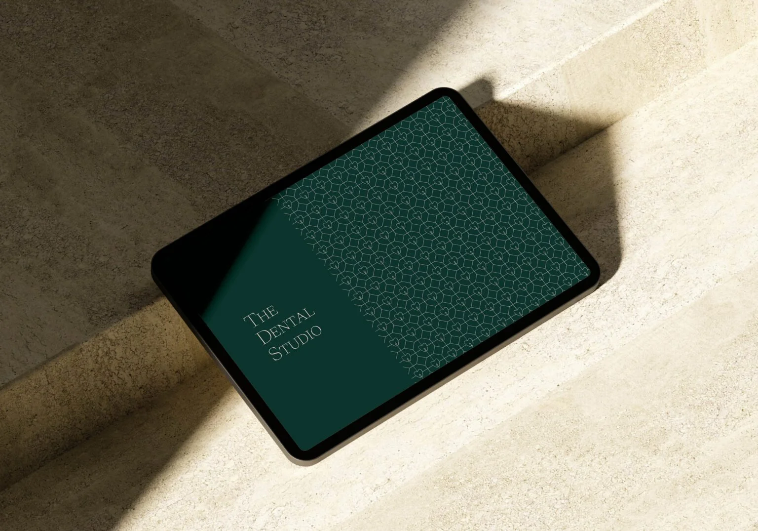 The Dental Studio branding with logo and pattern.