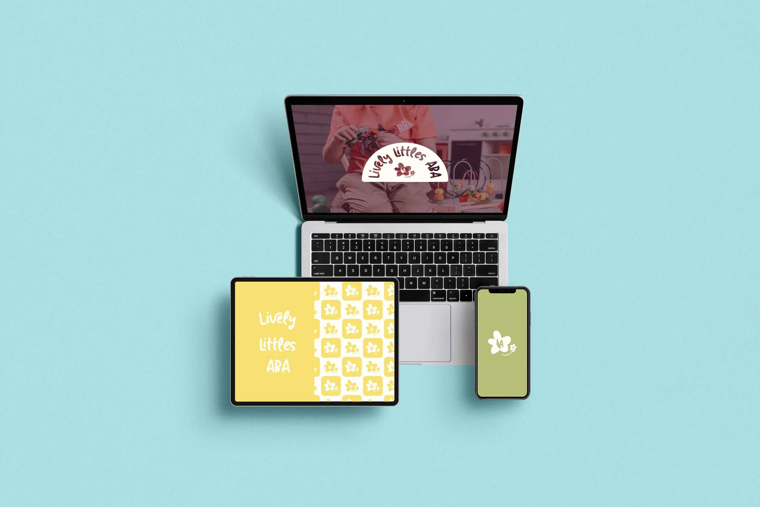 A laptop displaying a child playing with toys and the words Livley Littles ABA on the screen, accompanied by a smartphone with a green background and a white logo, and two tablets with yellow and black backgrounds and similar logos, on a light blue background.
