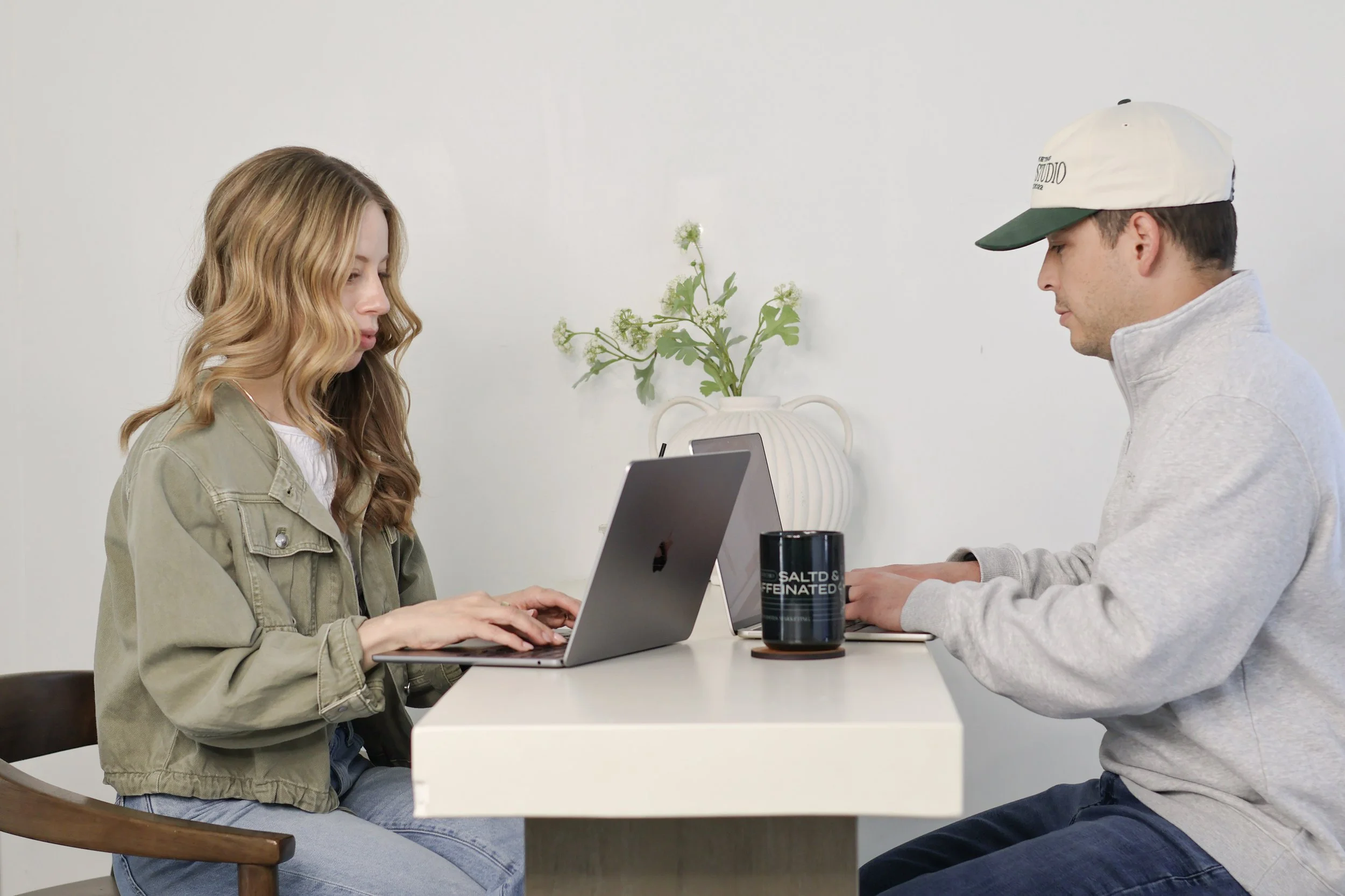 Emma and Cameron collaborating on a client’s project.