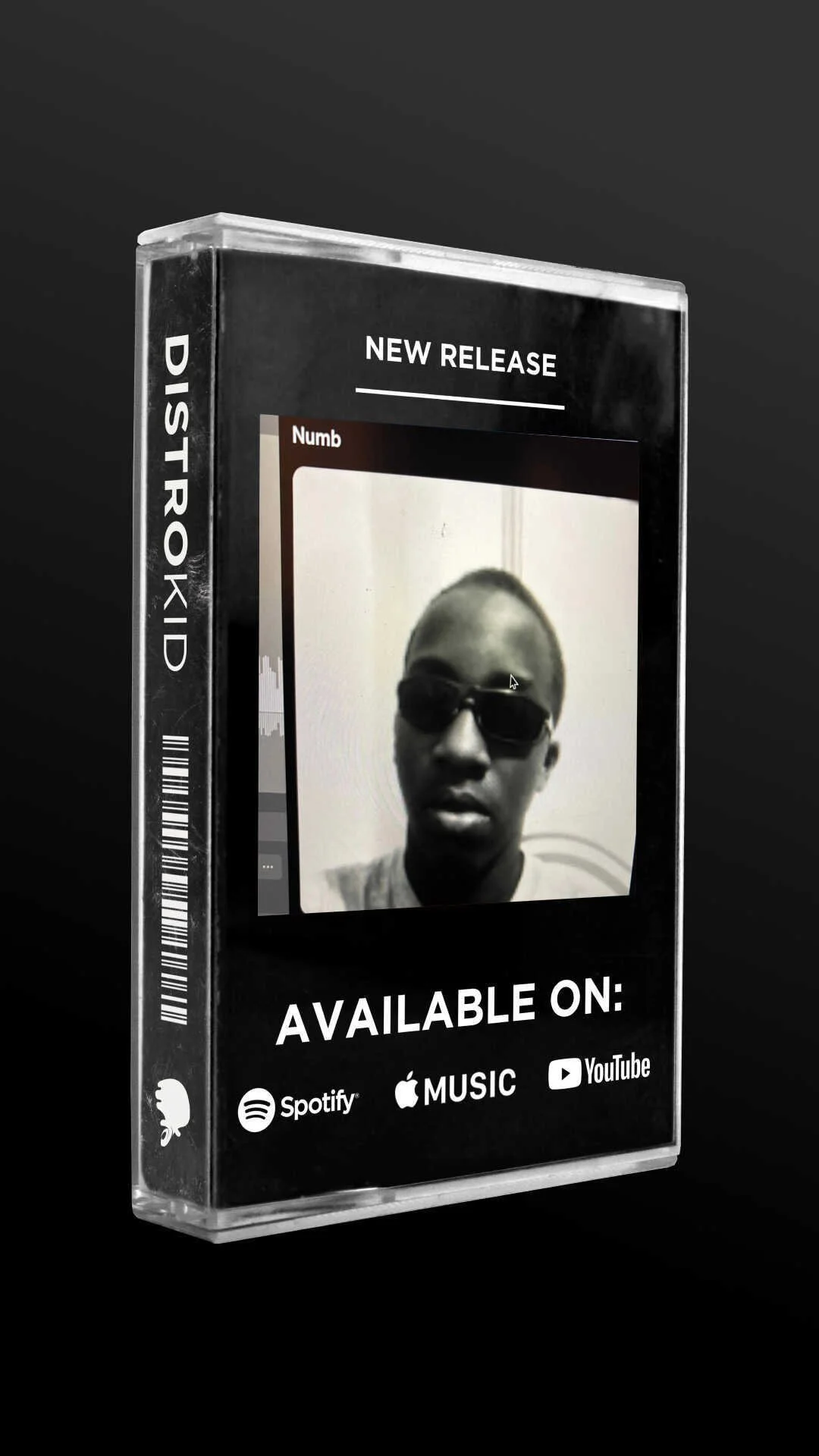 A product display box advertising a new music release available on Spotify, Apple Music, and YouTube, with a black and white photo of a person wearing sunglasses on the front.