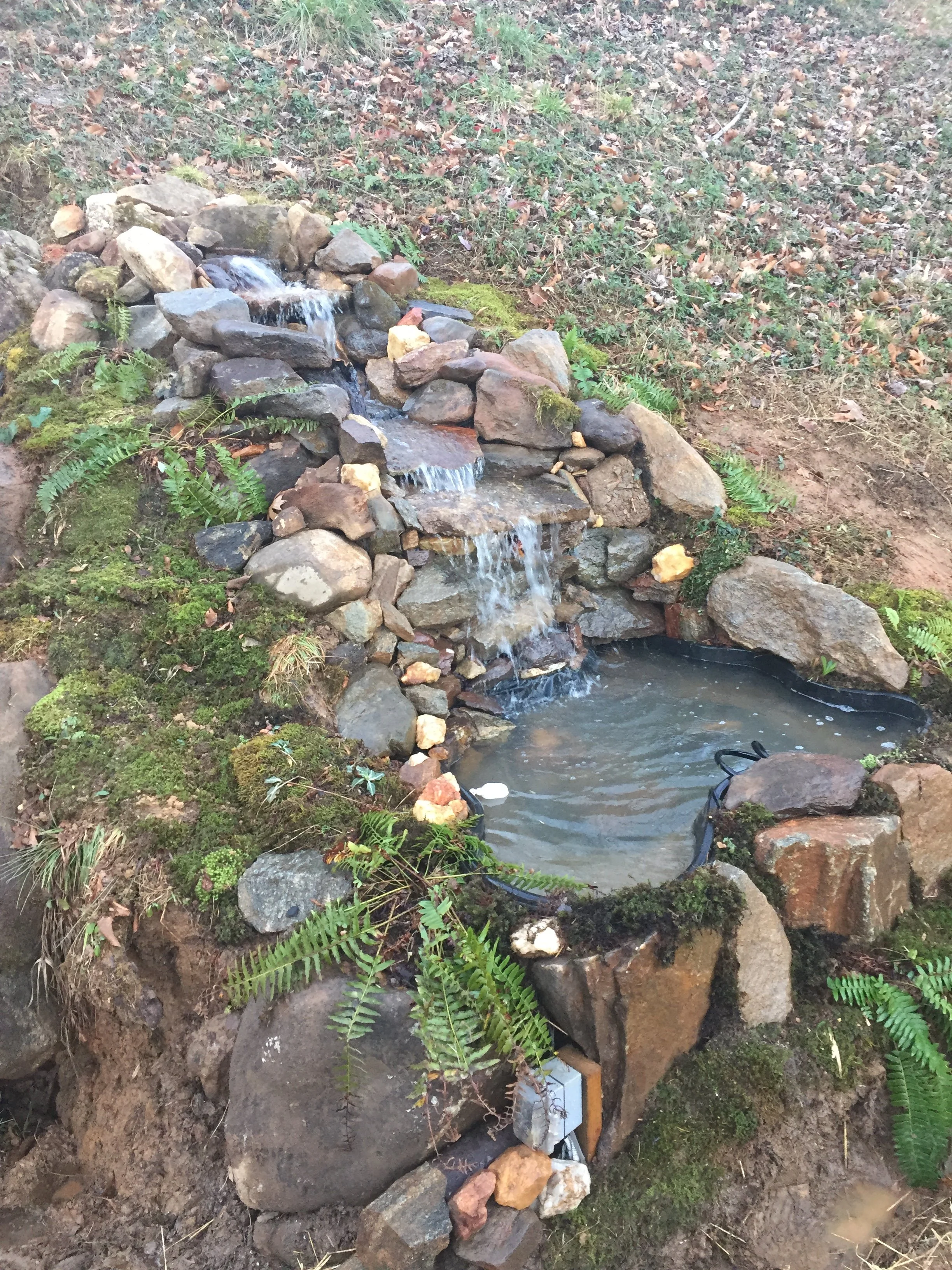 A handcrafted backyard water feature inspired by the natural streams of the Appalachian Mountains.