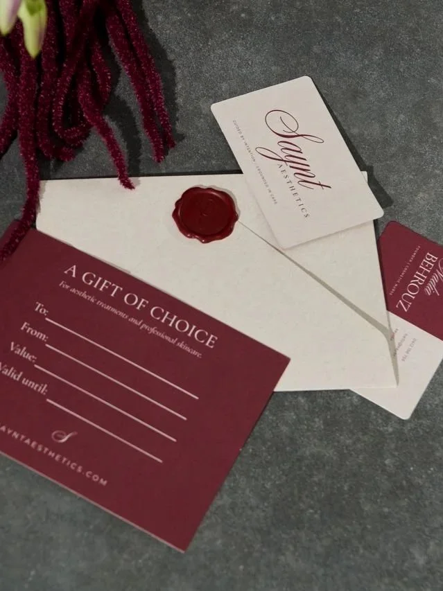 Saynt Aesthetics gift card with burgundy wax seal and luxury stationery in West Leederville, Perth.