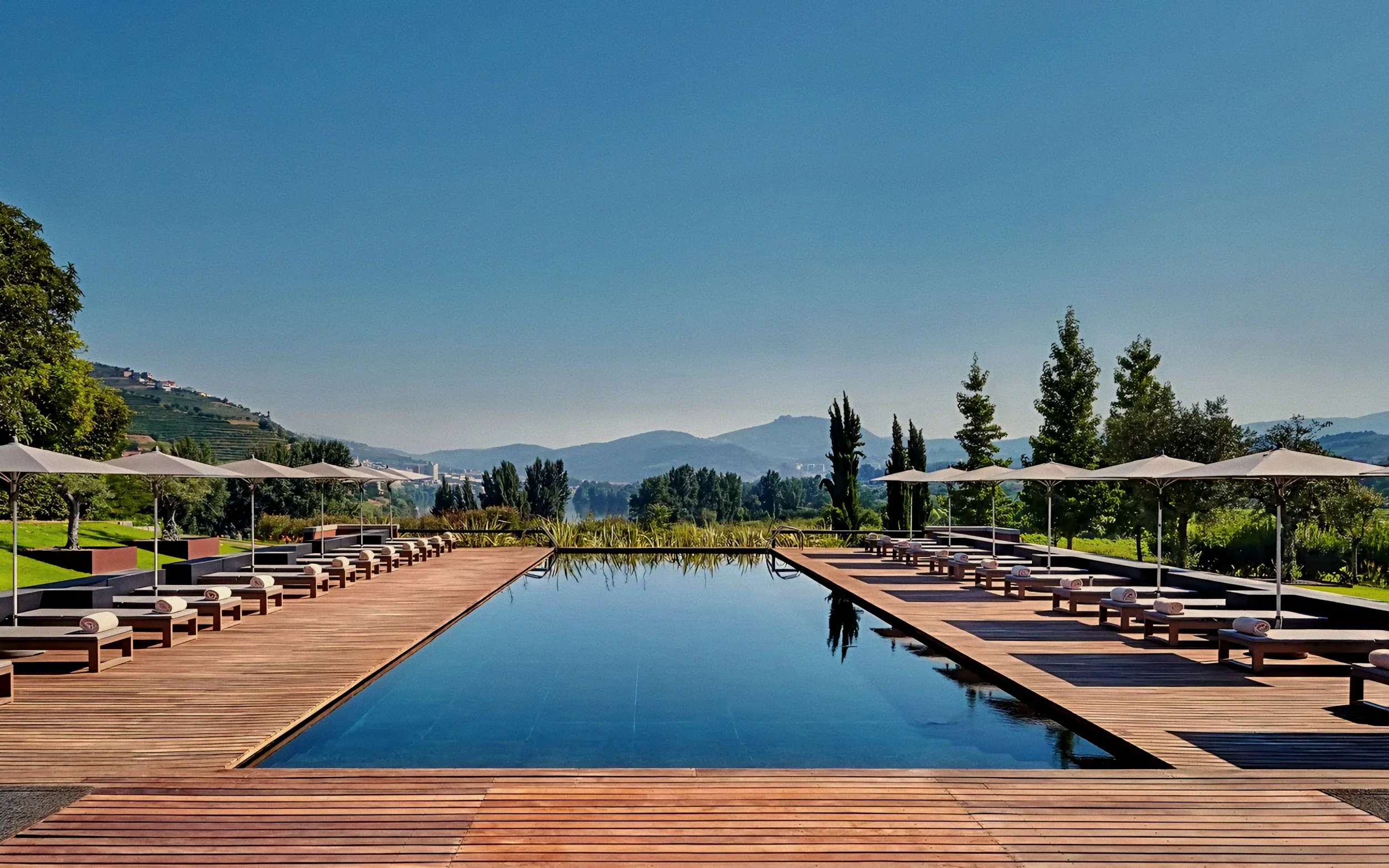 Linear infinity pool terrace and terraced hill vistas Six Senses Douro Valley Luxury Hotel in Portugal.