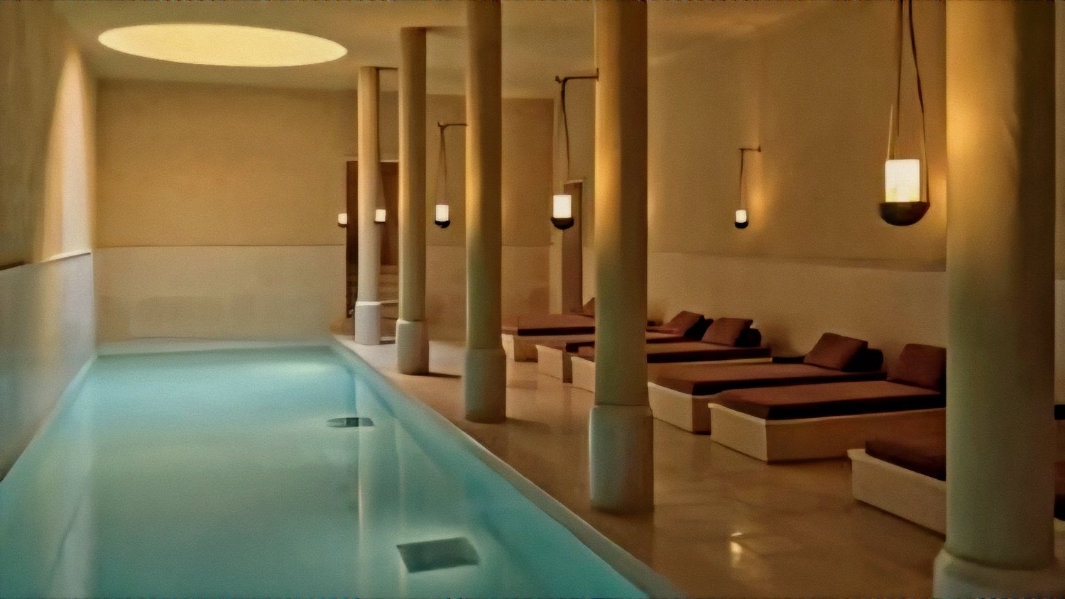 Serene indoor pool and stone column colonnade at Hôtel du Couvent, a Luxury Collection Hotel, Nice, France.