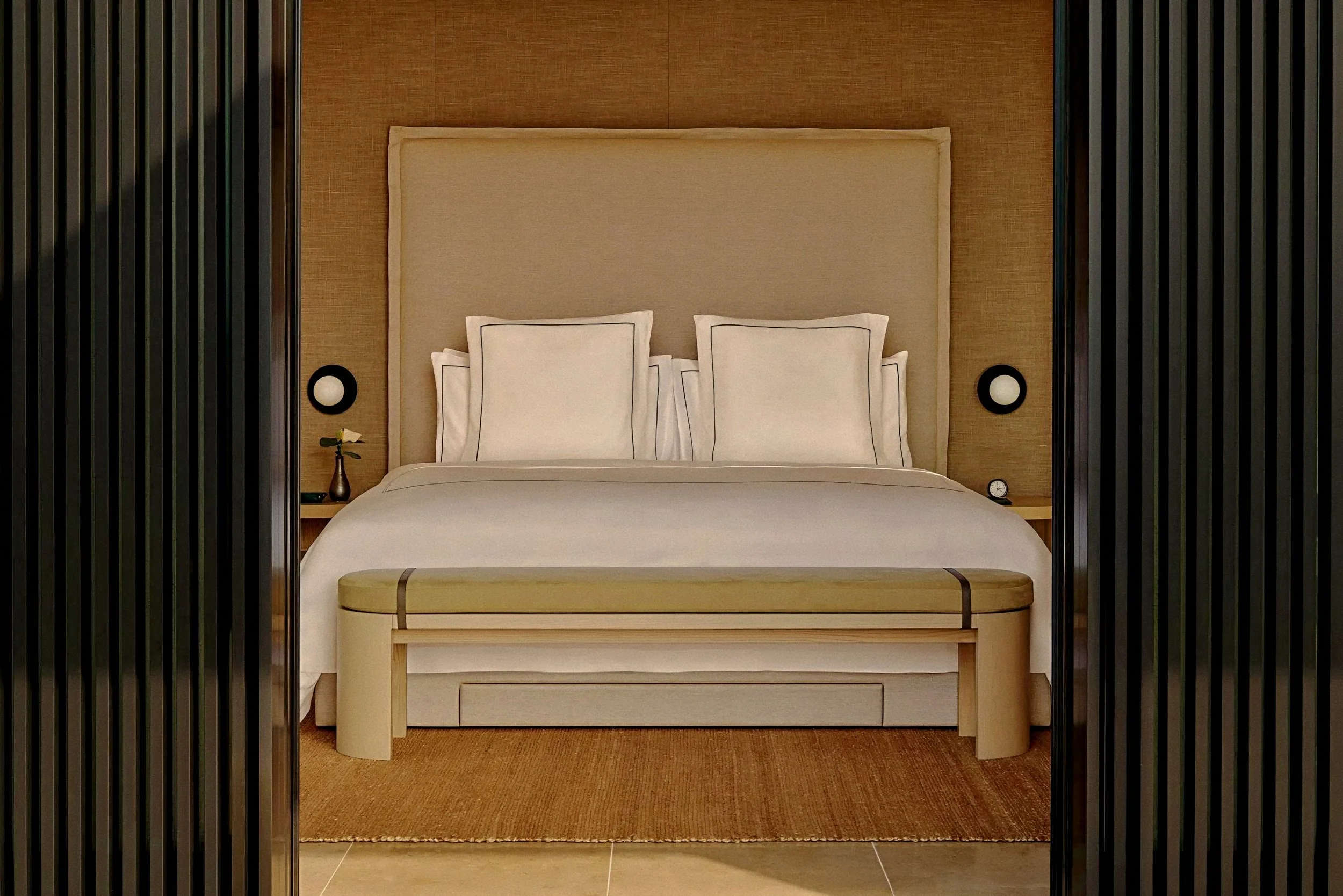 Minimalist primary bedroom suite at Rosewood Miyakojima luxury villas in Okinawa, Japan, across the Ryukyu Islands.