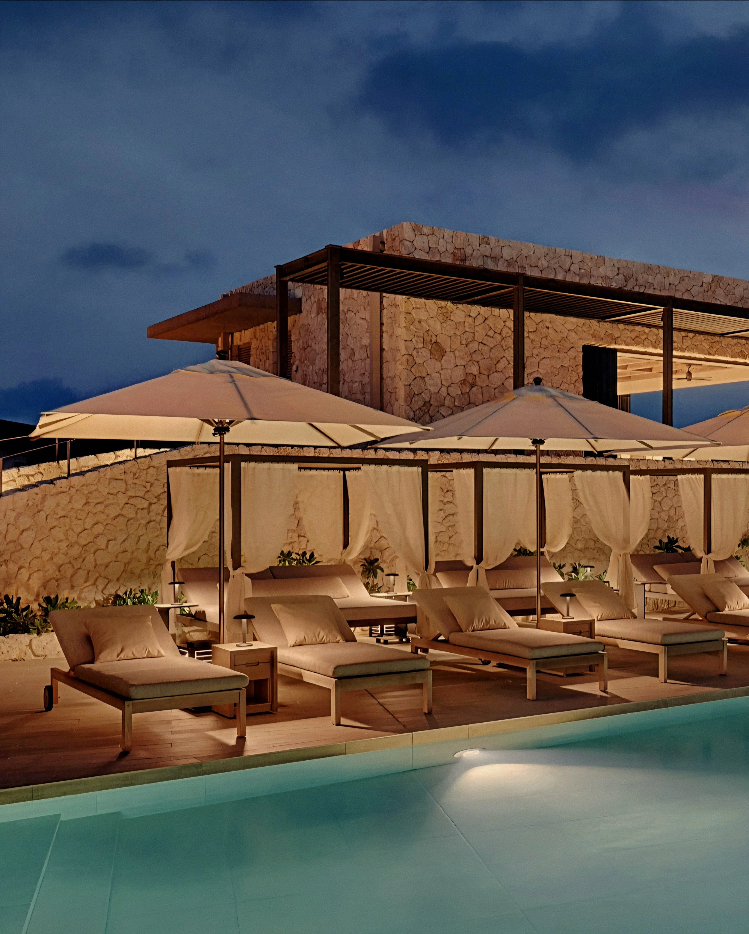 Evening luxury pool deck and cabanas at Rosewood Miyakojima resort in Okinawa, Japan, on the Ryukyu Islands.