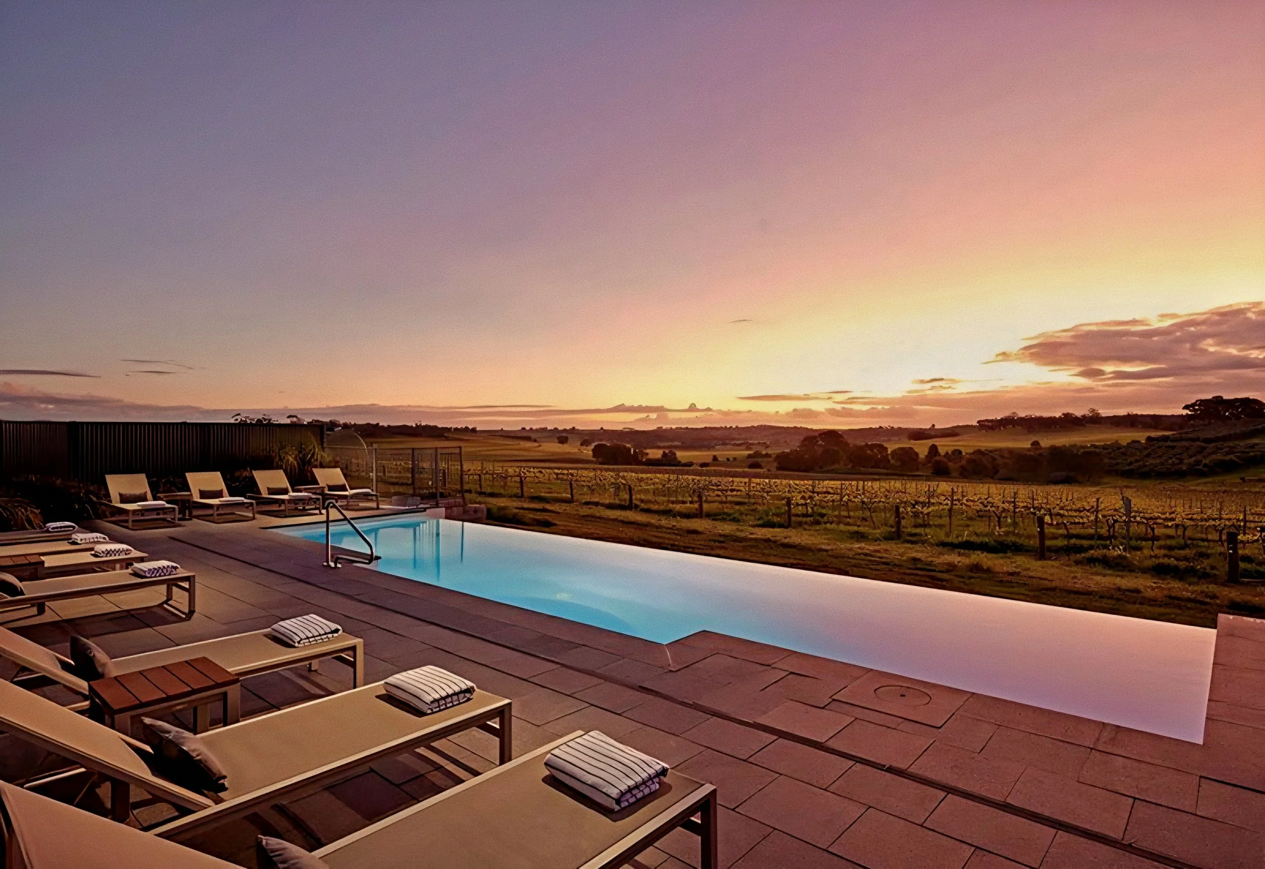 The Louise beckons luxury vineyard resort pool at sunset in Marananga Barossa Valley South Australia.
