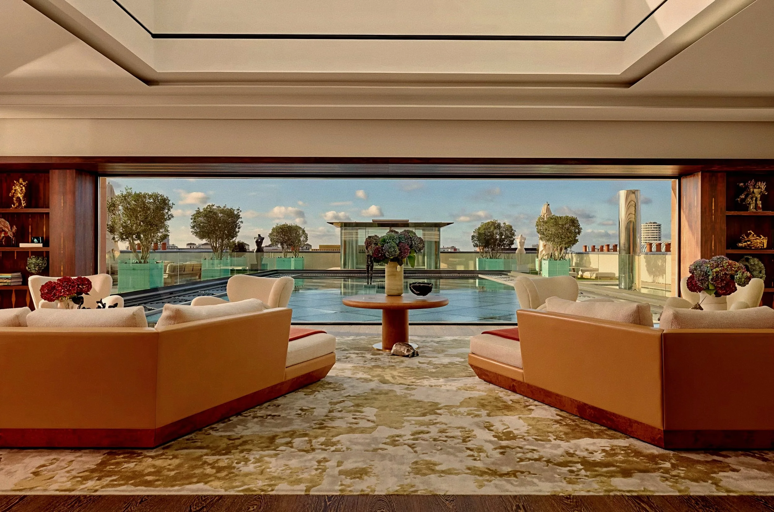 Luxury penthouse living lounge with rooftop terrace views at Claridge's Hotel Mayfair London.