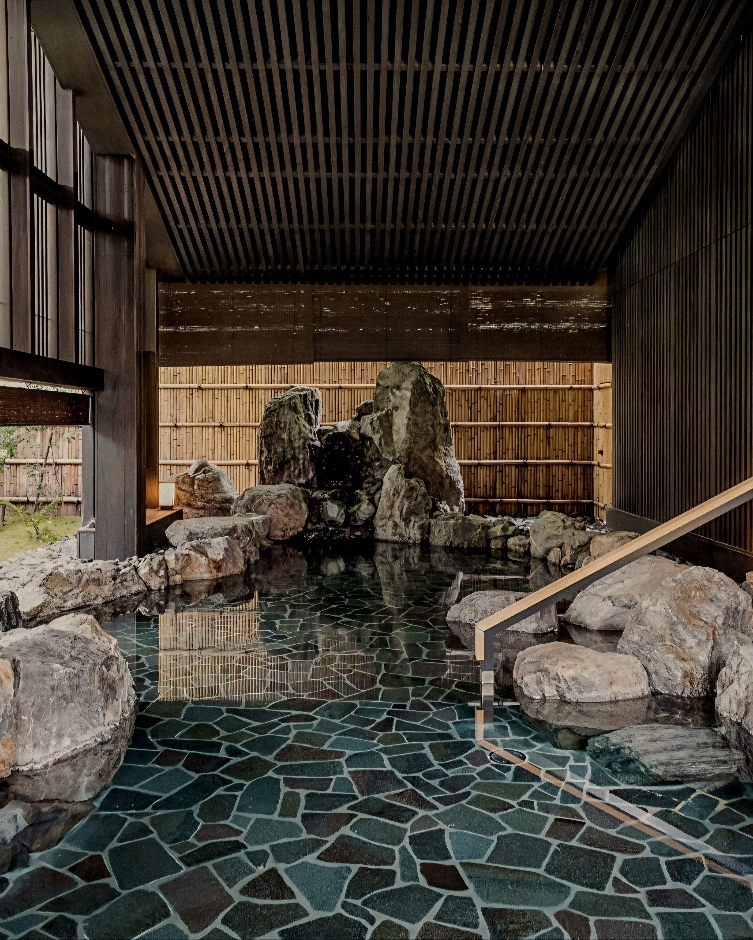 Natural stone onsen spring bath at Aman Kyoto luxury onsen spa and ryokan in Japan.