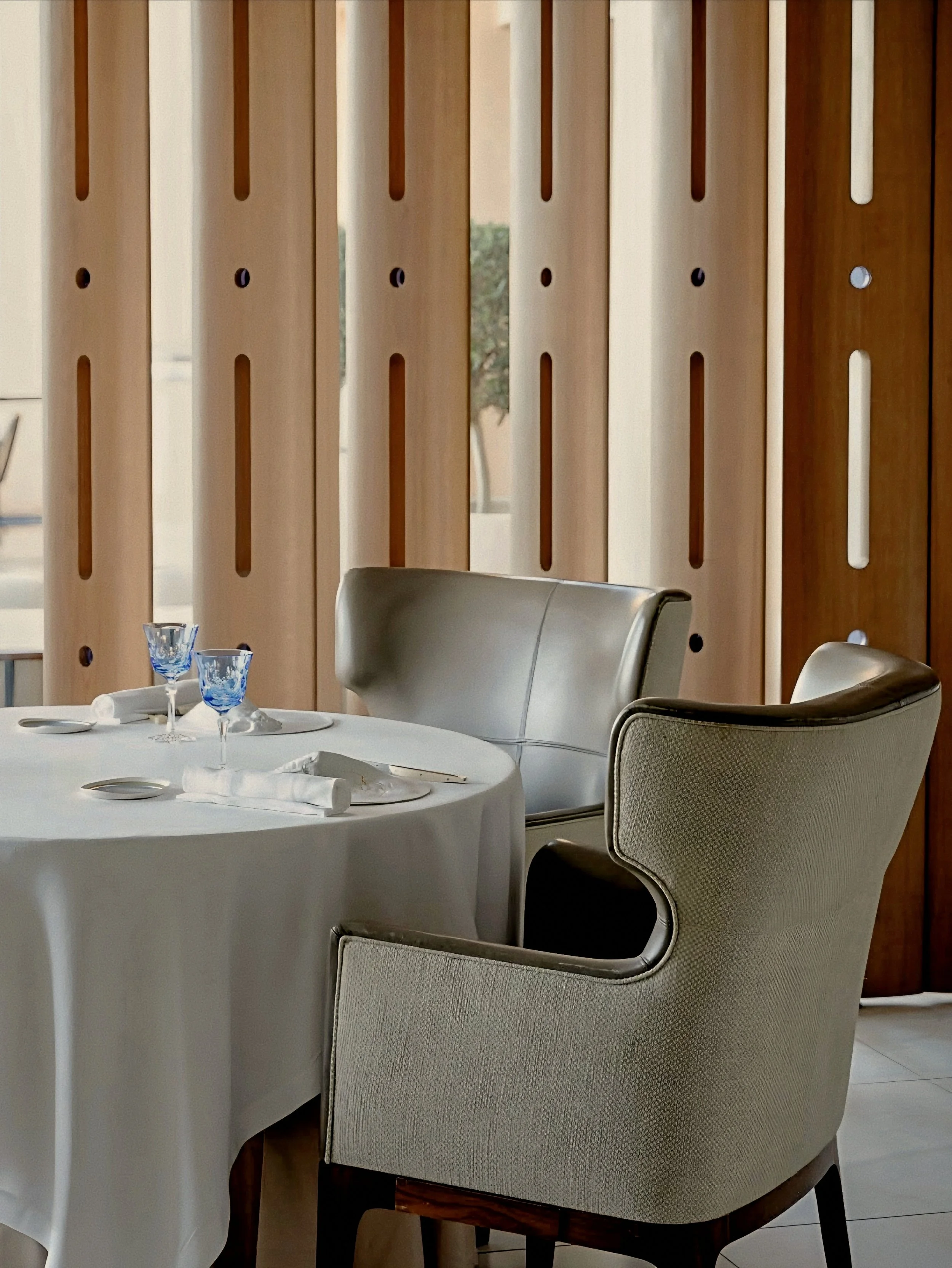 Vertical timber screens and Arnaud Donckele dining at La Vague d'Or Saint Tropez three Michelin-Starred Restaurant in France.