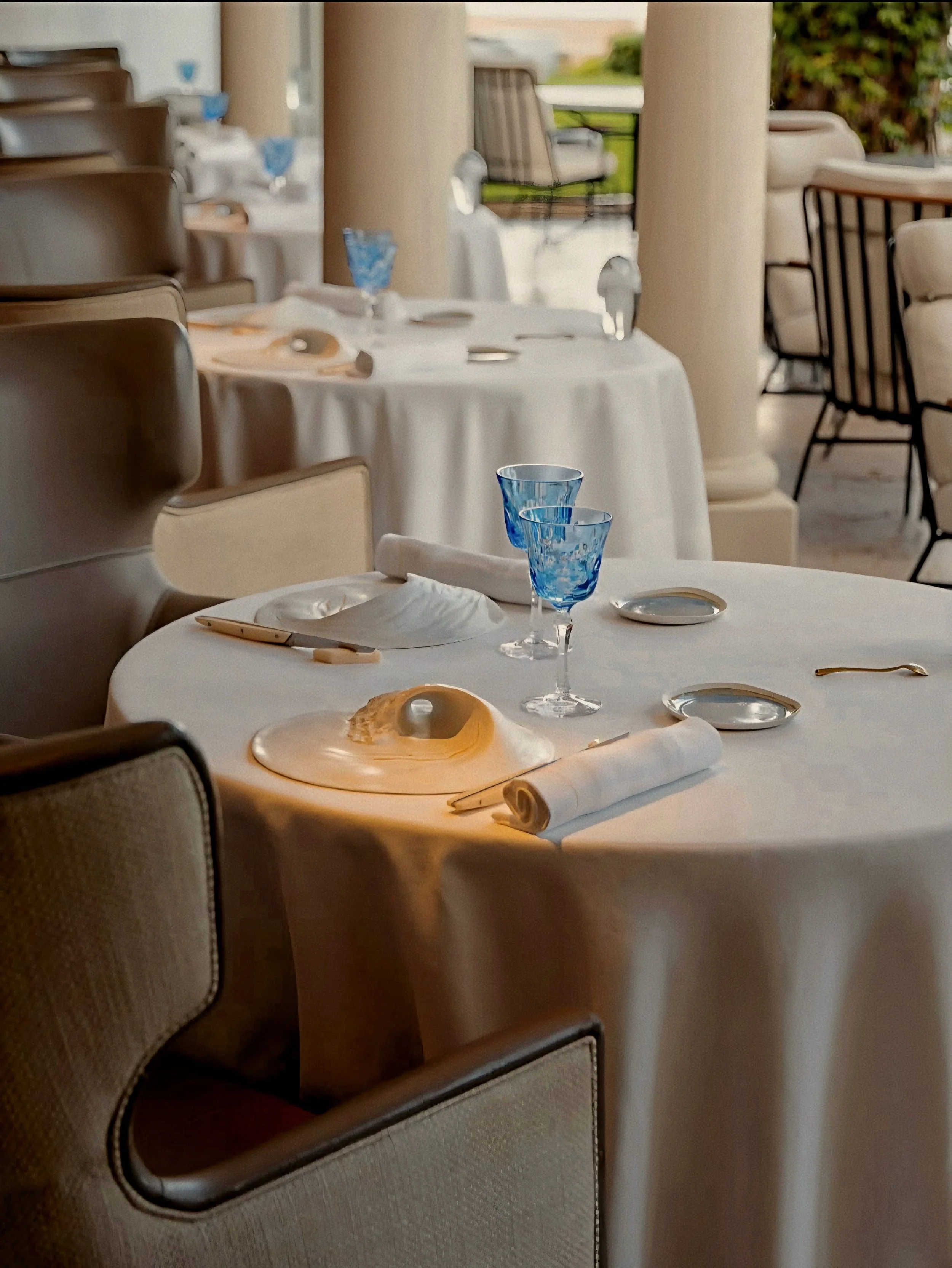 Table settings and Arnaud Donckele cuisine at La Vague d'Or Saint Tropez three Michelin-Starred Restaurant in France.