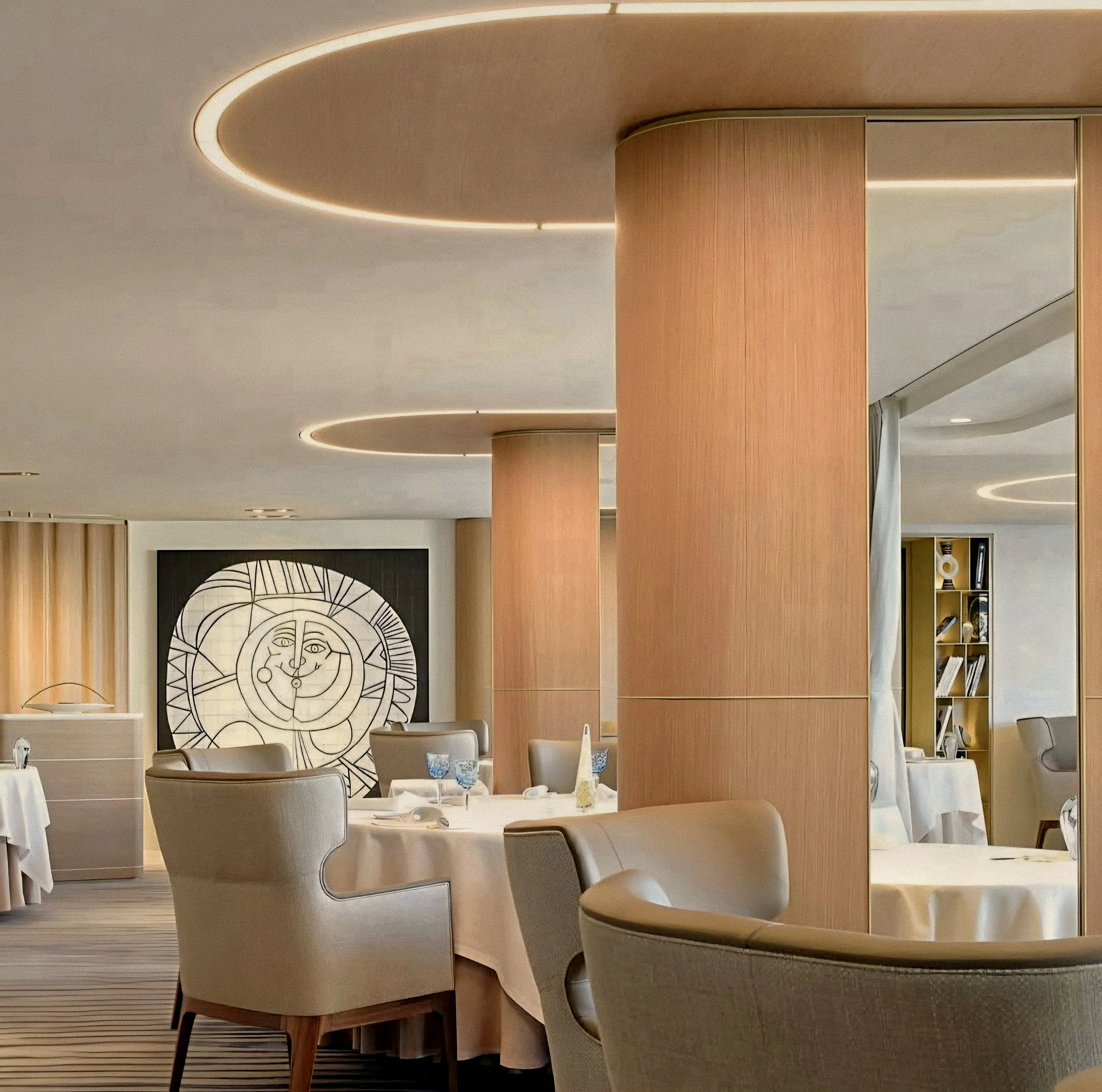 Timber curves and Arnaud Donckele interior at La Vague d'Or Saint Tropez three Michelin-Starred Restaurant in France.