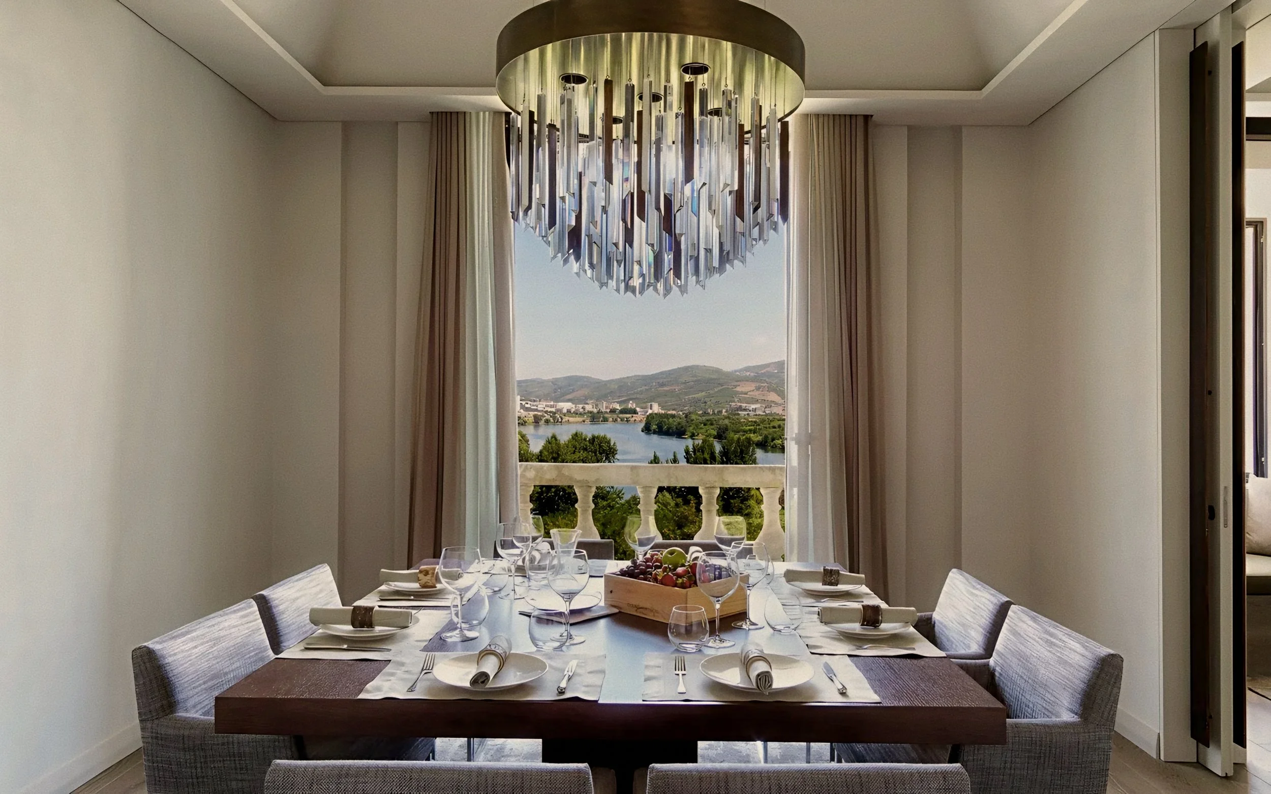 Crystal chandelier and river view dining salon Six Senses Douro Valley Luxury Hotel in Portugal.