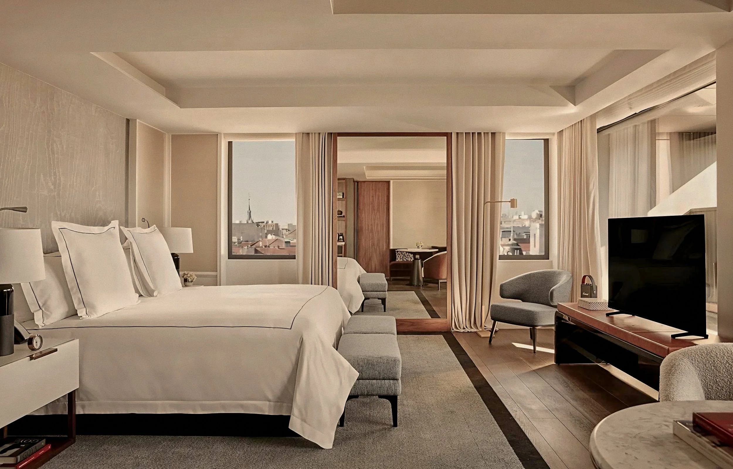Elegantly designed suite bedroom at Rosewood Villa Magna in Salamanca Madrid Spain featuring neutral decor.