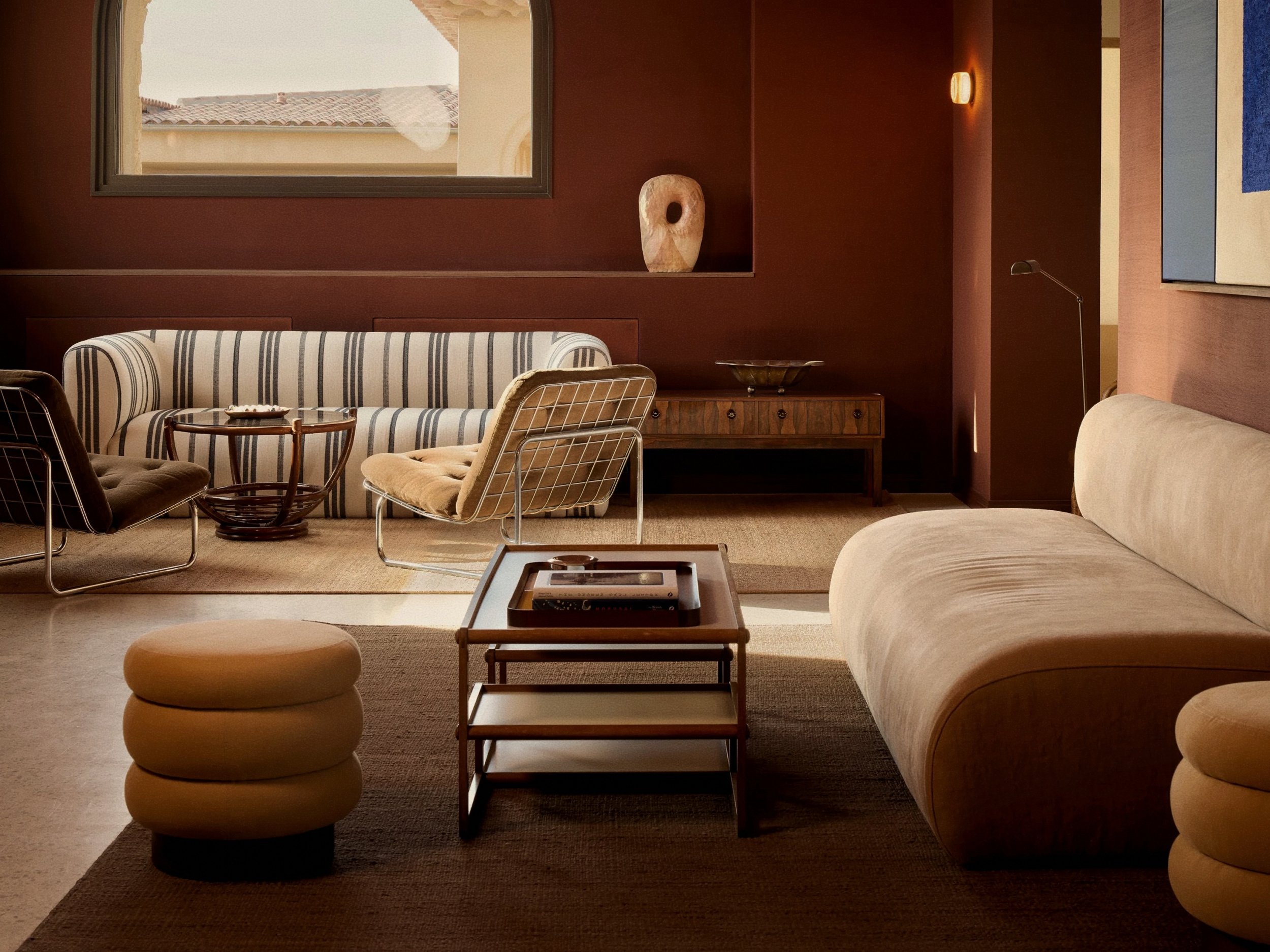 Ochre-toned luxury living room salon at Zannier Île de Bendor in South of France, Provence.