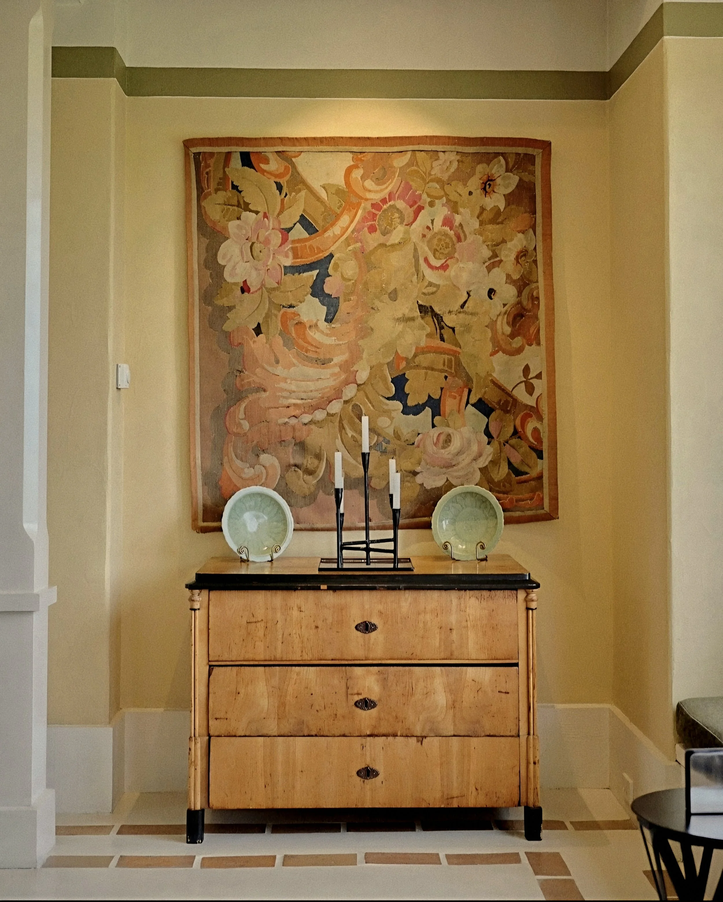 Antique burl wood commode and vintage tapestry curated by Virginia Fisher at Wharekauhau Country Estate, New Zealand.