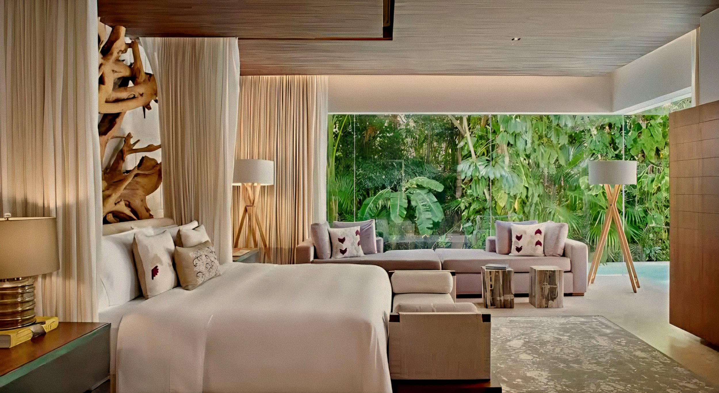 Luxury suite bed with organic driftwood art at Hacienda Chablé Yucatán, Chocholá, Mexico.