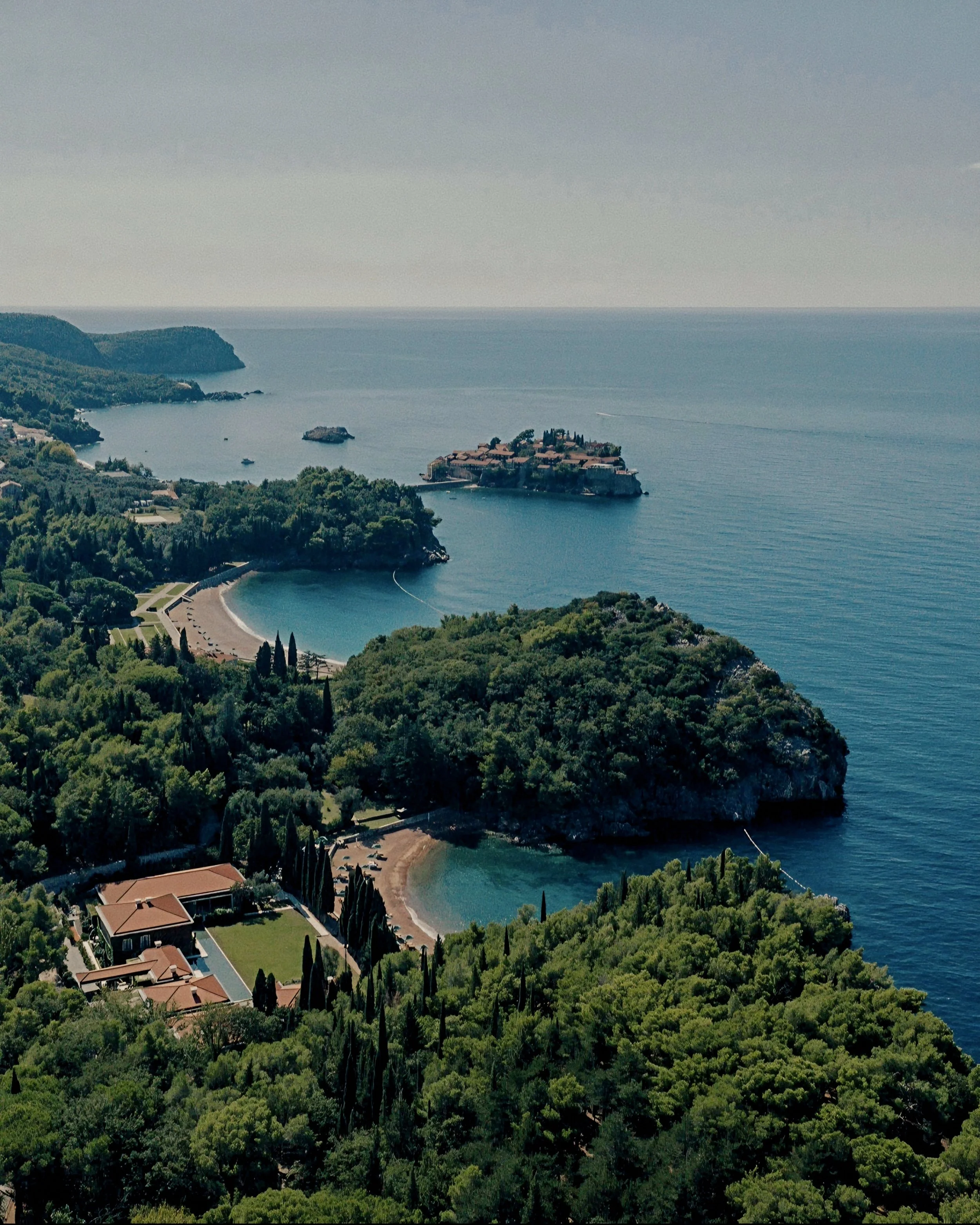 Ancient stone village islet and crystal Adriatic sea Aman Sveti Stefan Luxury Resort in Montenegro.