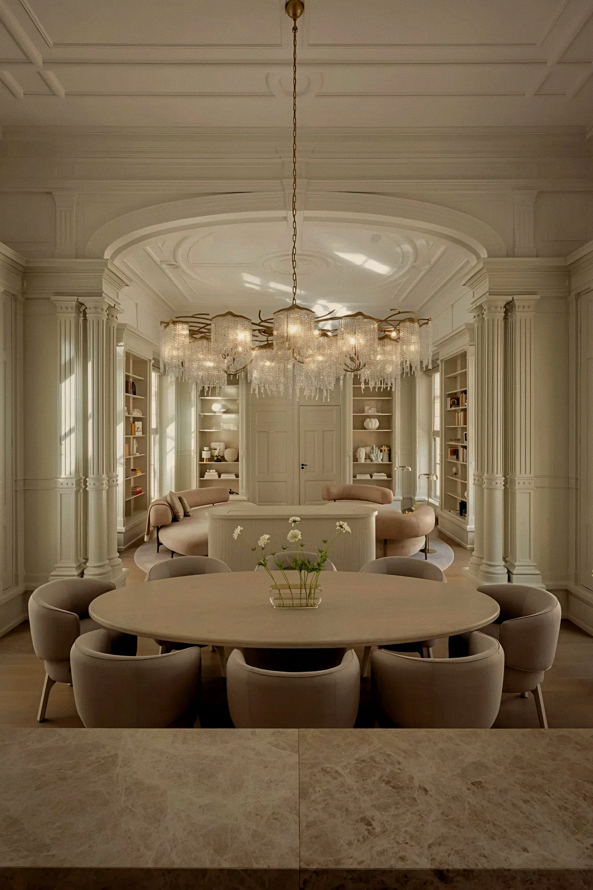 Private dining table under crystal chandelier at Rosewood Amsterdam a luxury hotel in Netherlands.