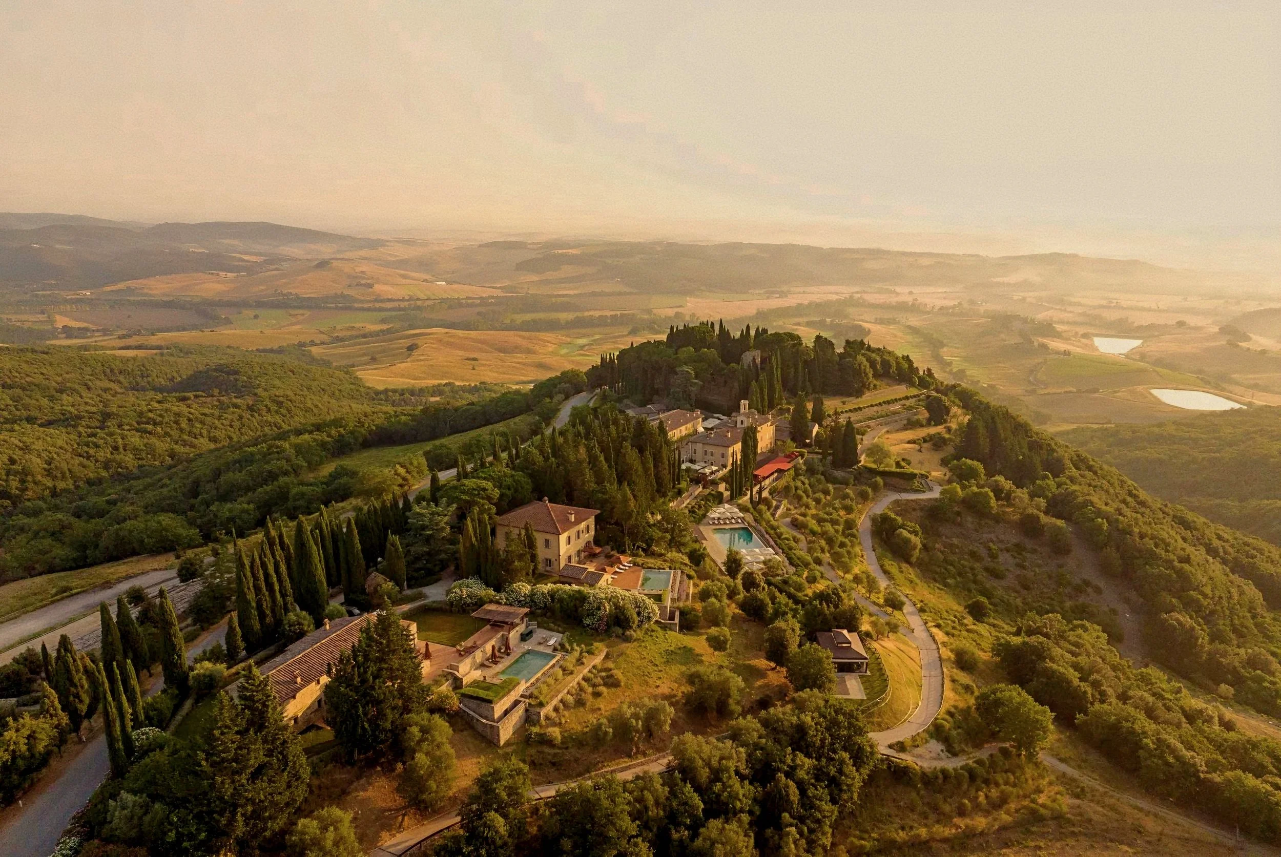 Aerial view of historic estate at Castiglion del Bosco, A Rosewood Hotel, Val d'Orcia, Tuscany, Italy.