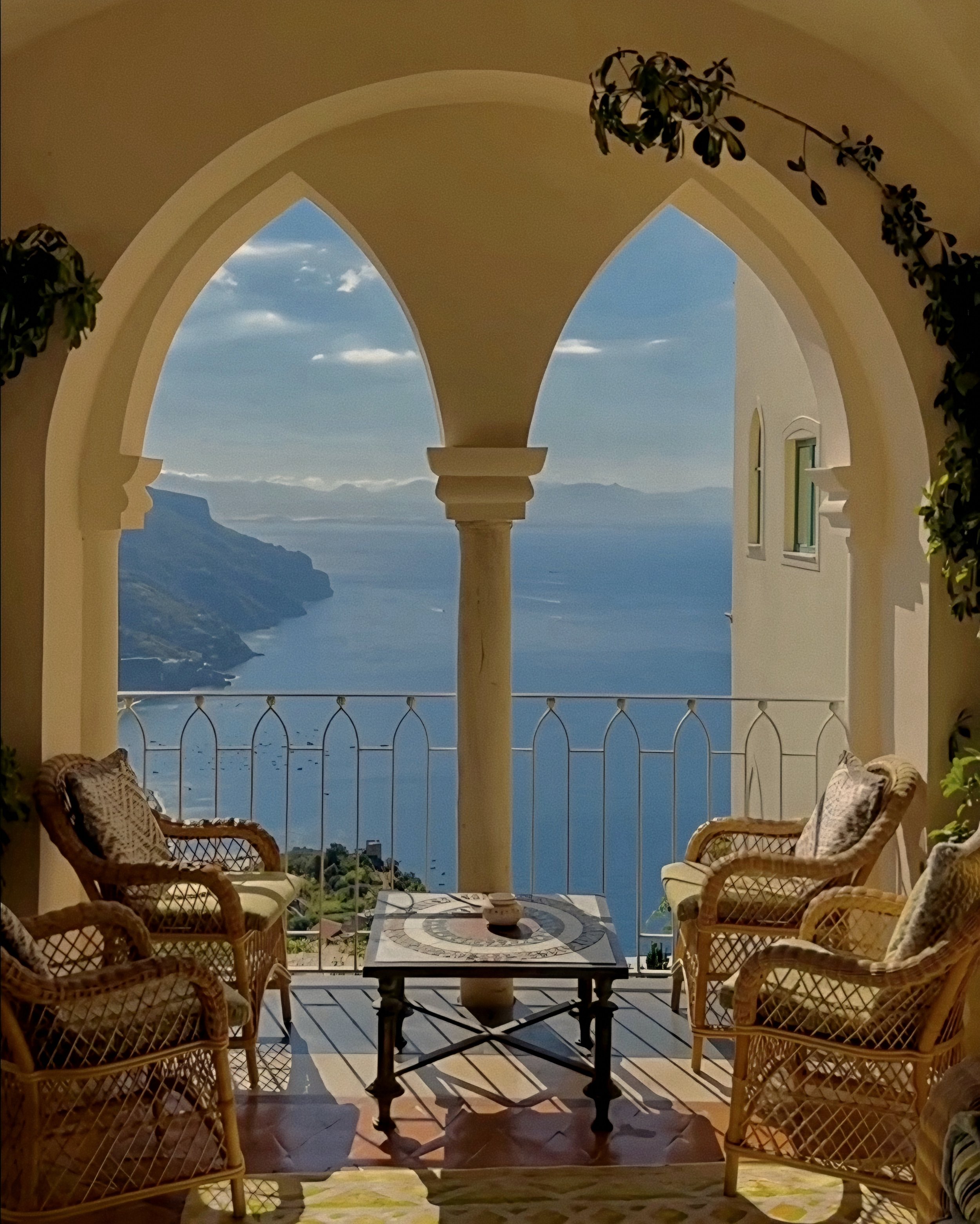 Ancient stone loggia with rattan seating at Caruso A Belmond Hotel Ravello Amalfi Coast Italy