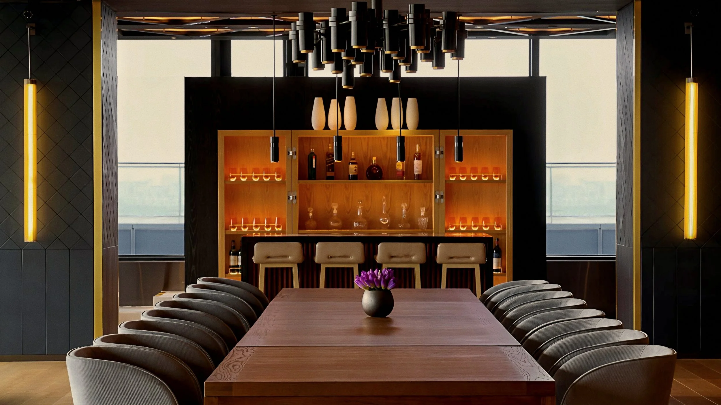 Tailored timber dining table and ribbed armchairs At The PuXuan Hotel and Spa in Beijing, China.