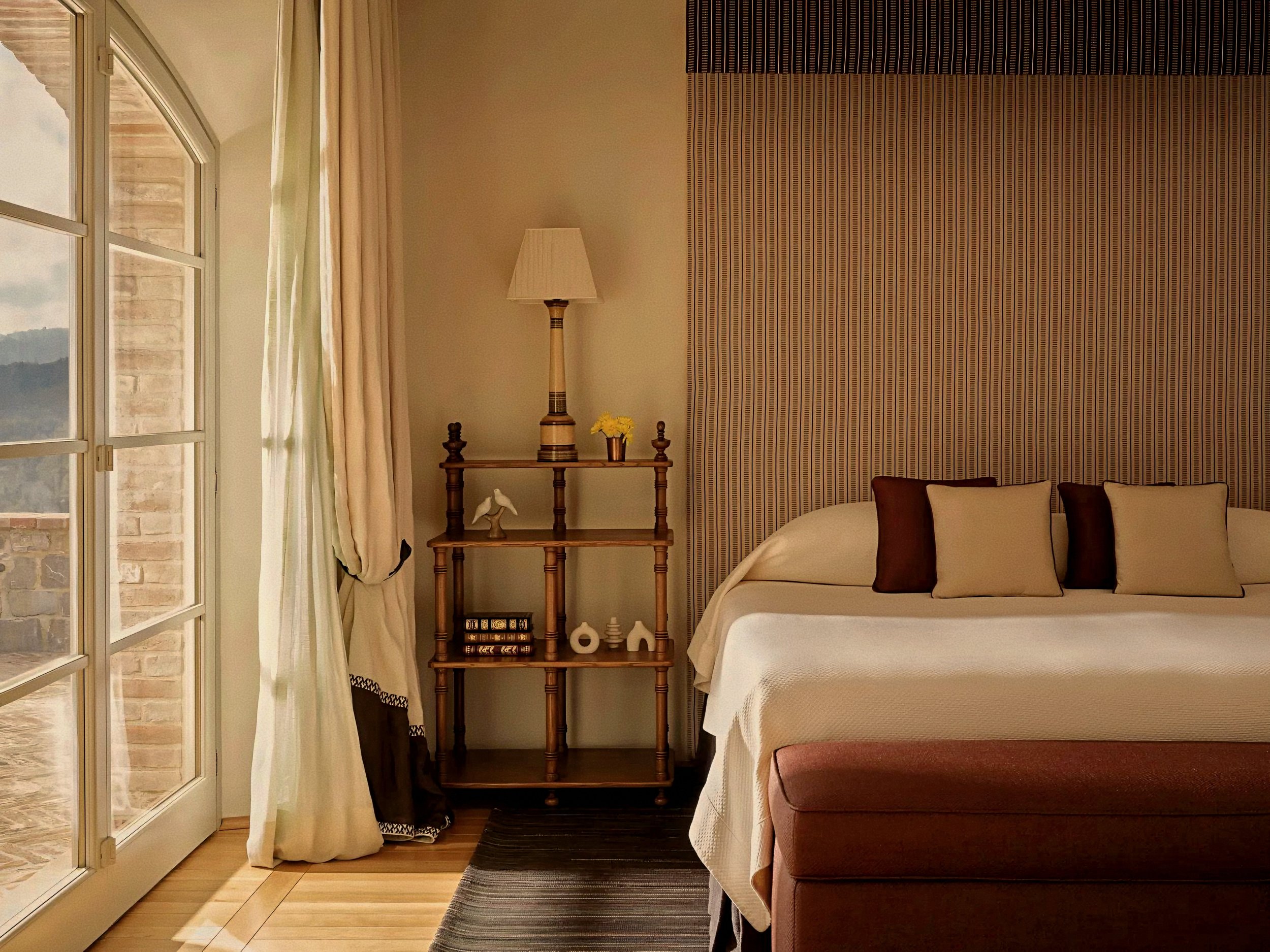 Linen drapery and bespoke timber bedroom at Castiglion del Bosco, A Rosewood Hotel, Val d'Orcia, Tuscany, Italy.