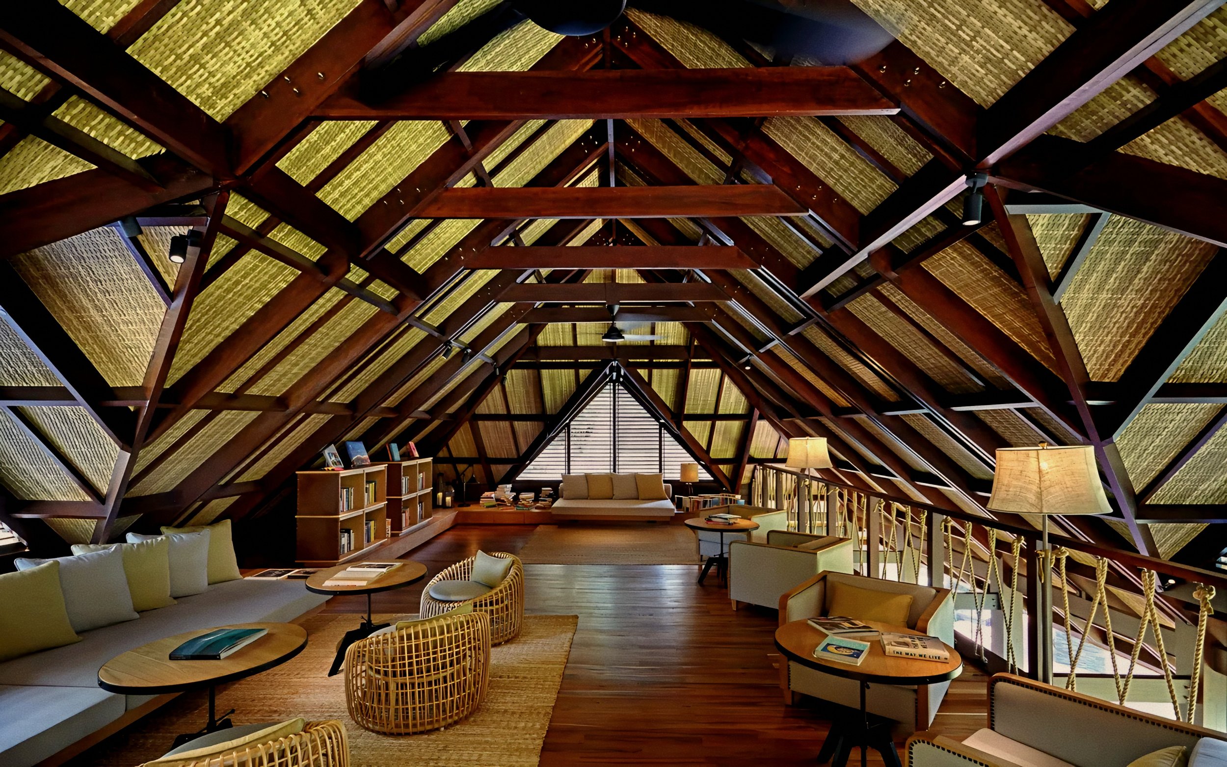 Timber trusses and library lounge at Six Senses Zil Pasyon, Felicite Island luxury hotel in Seychelles.