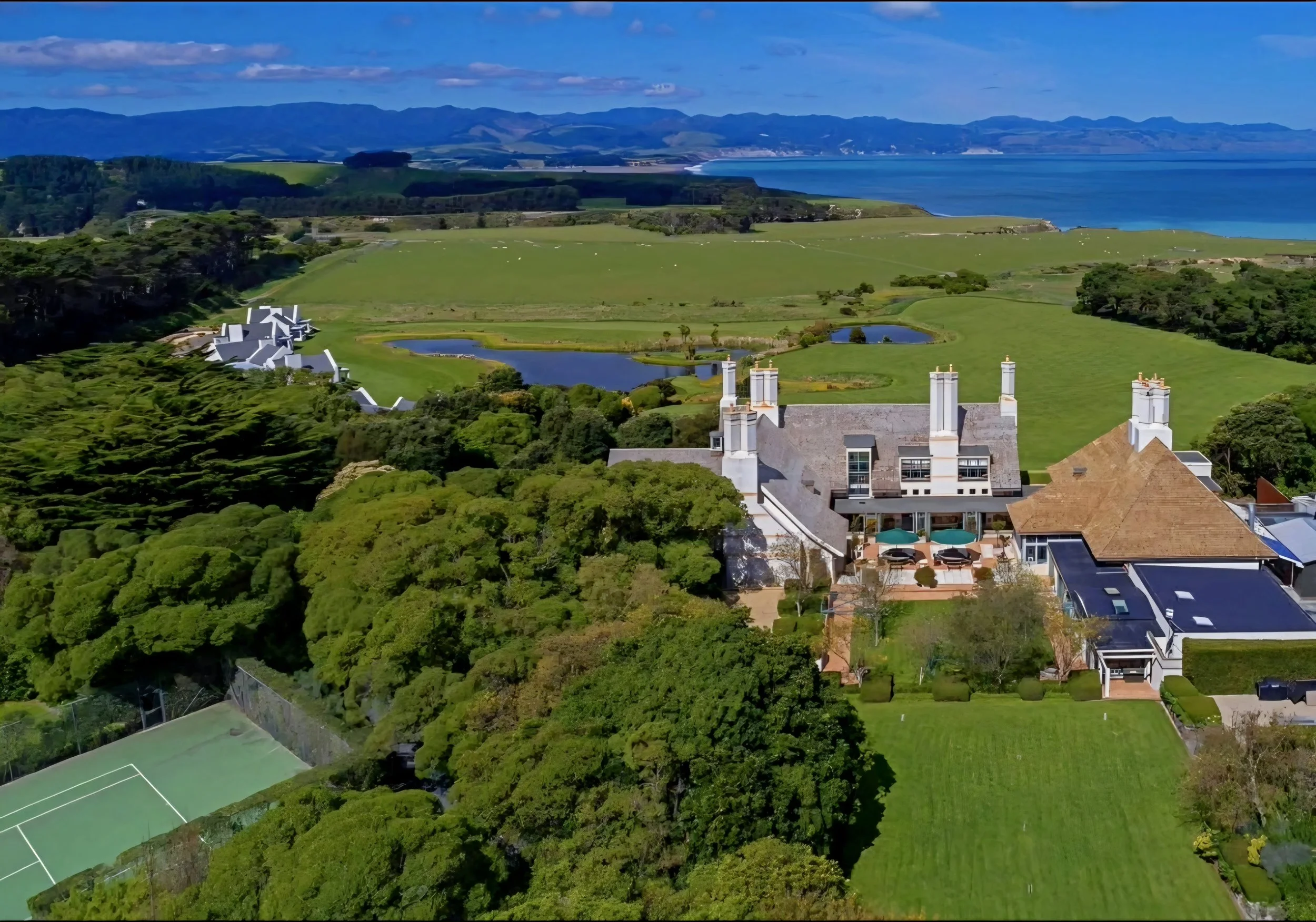 Aerial panorama of the 3000-acre coastal estate at Wharekauhau Country Estate luxury lodge, Palliser Bay, New Zealand.