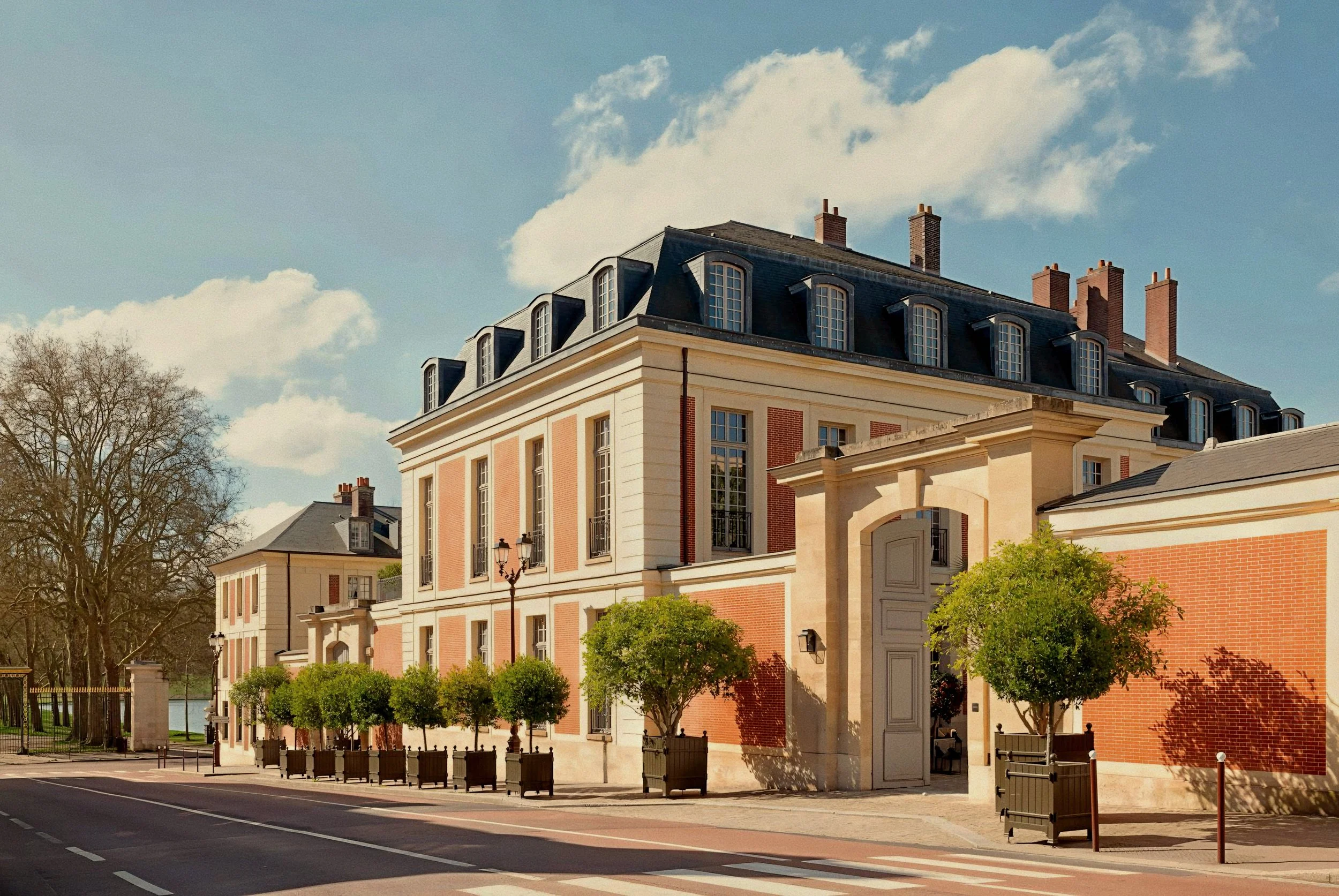 Classical limestone facade and Mansard roof exterior Airelles Château de Versailles, Le Grand Contrôle, France.
