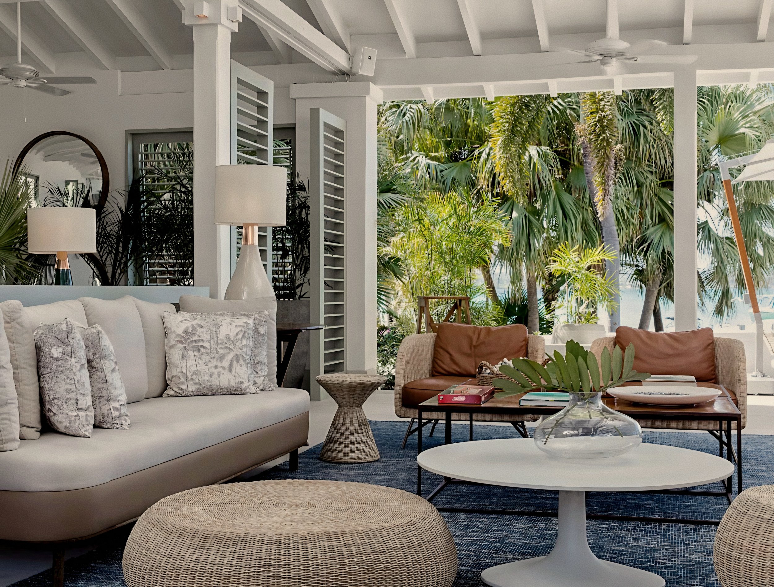 Open-air verandah lounge with timber trusses at Jumby Bay luxury private island, Antigua.