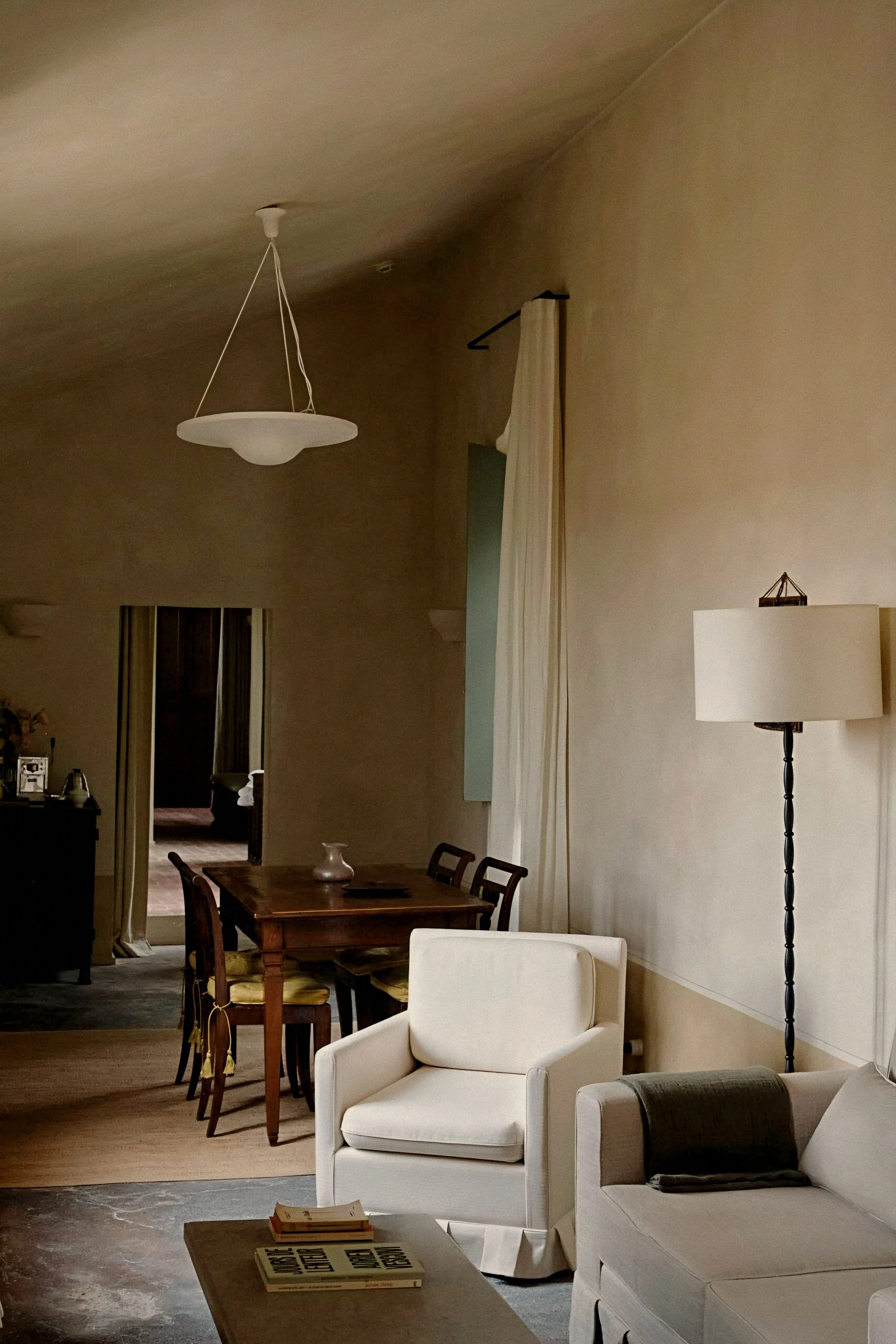 Tailored slipcovered armchairs and lime wash walls at Hôtel du Couvent, a Luxury Collection Hotel, Nice, France.