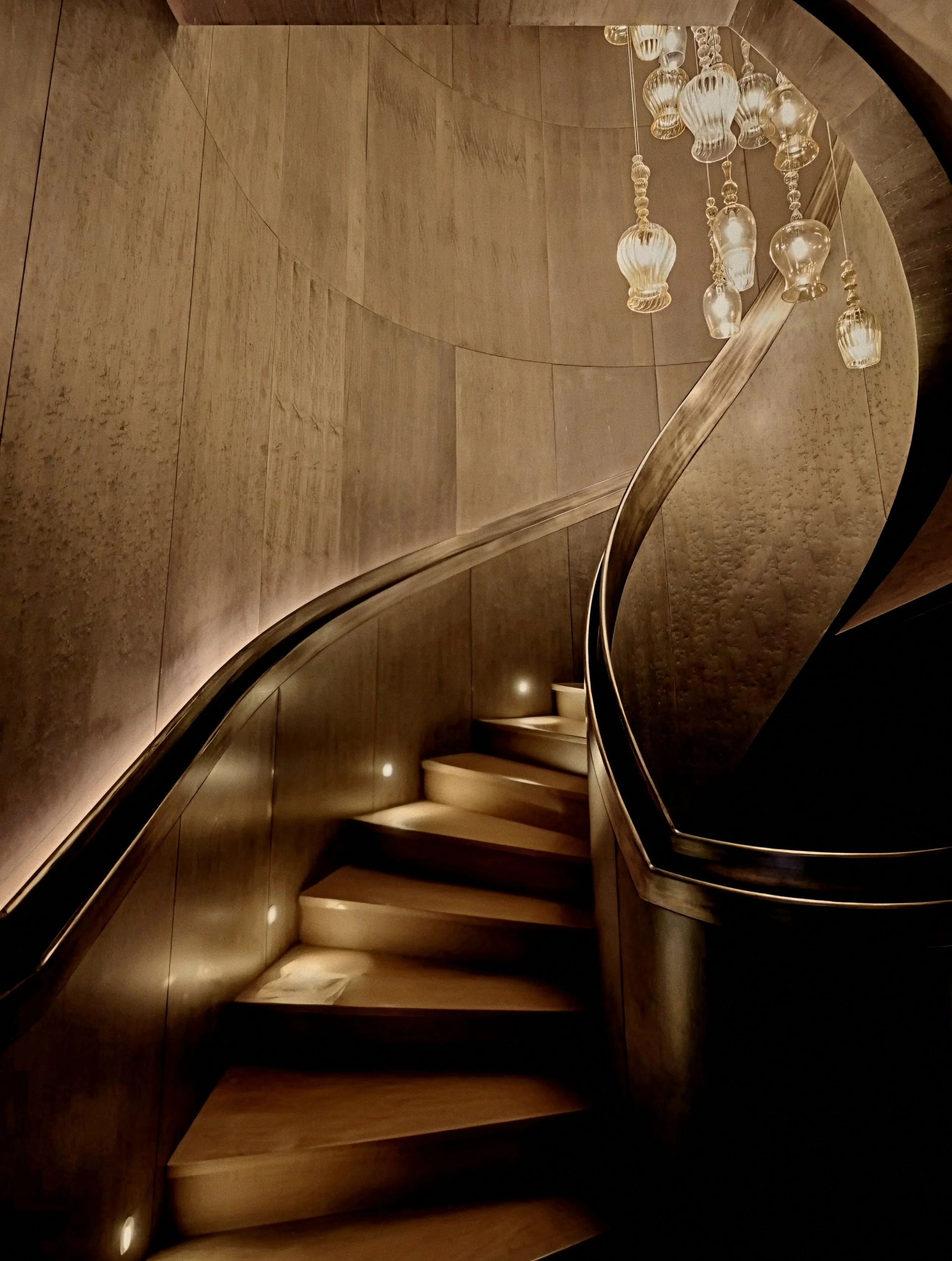 Bronze spiral staircase and glass pendants at Mandarin Oriental Bosphorus, Istanbul.