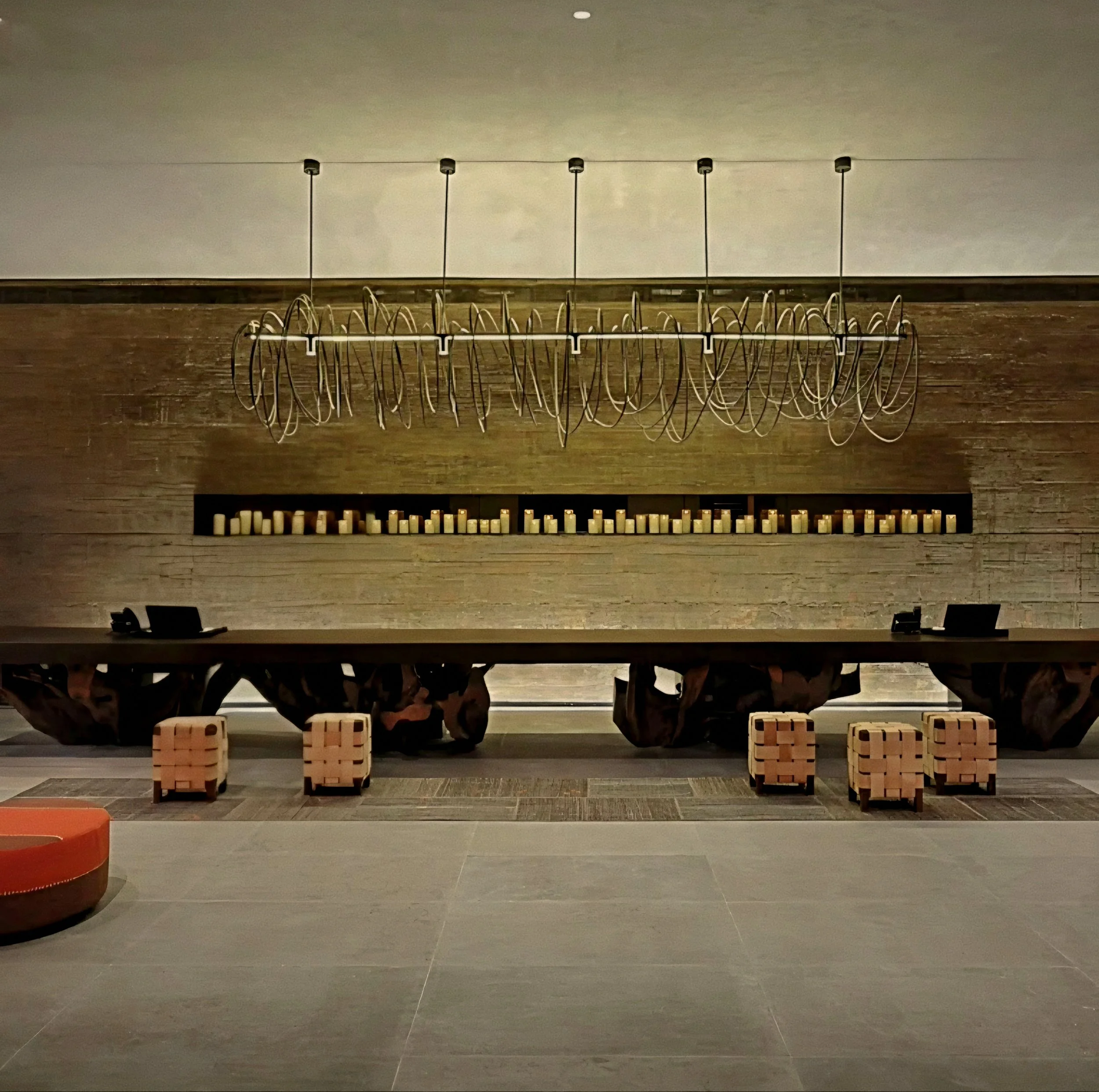 Sculptural timber desk and wire chandelier lobby Six Senses Douro Valley Luxury Hotel in Portugal.