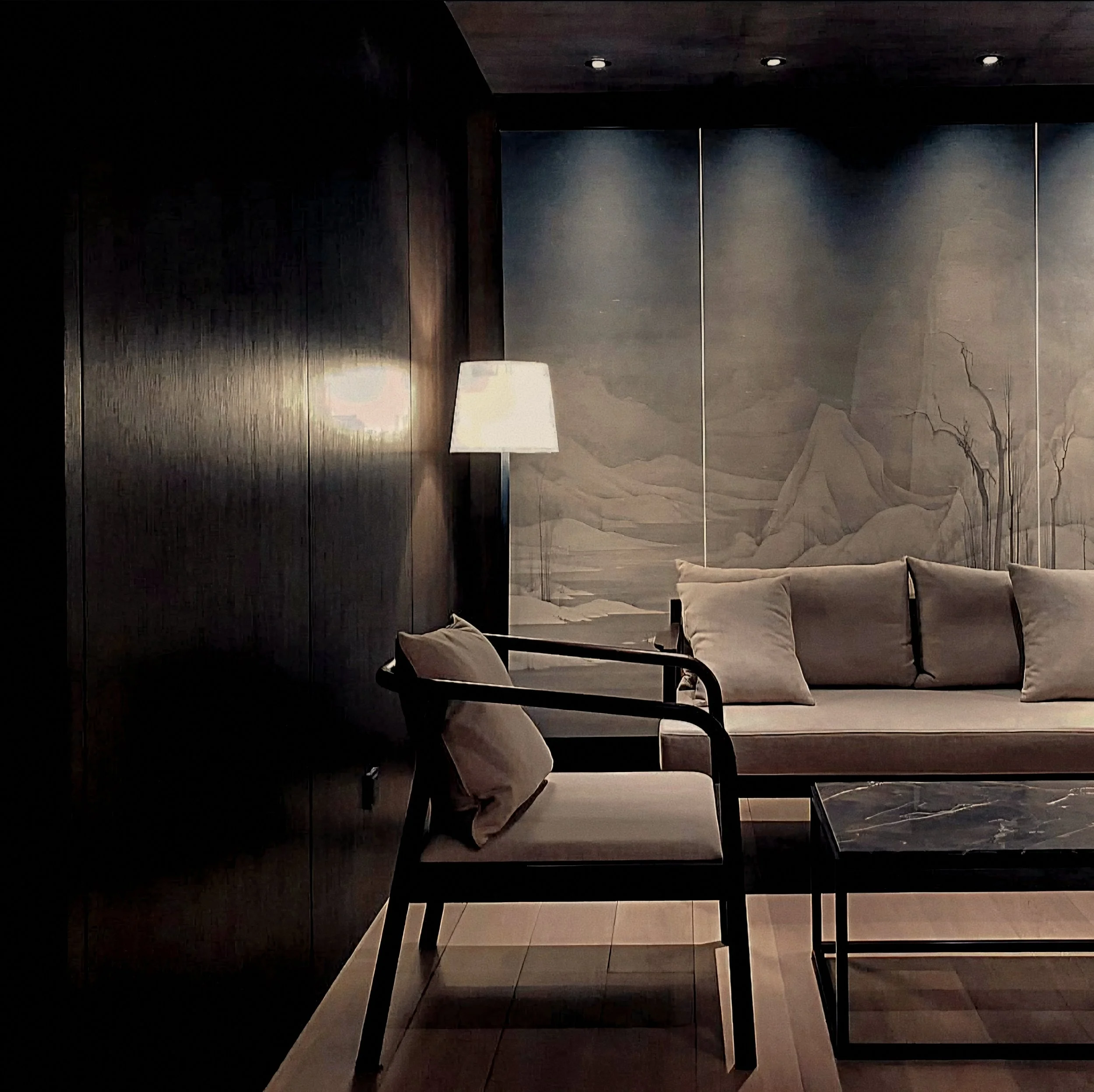 Low slung lounge seating and mountain mural wall At The PuXuan Hotel and Spa in Beijing, China.