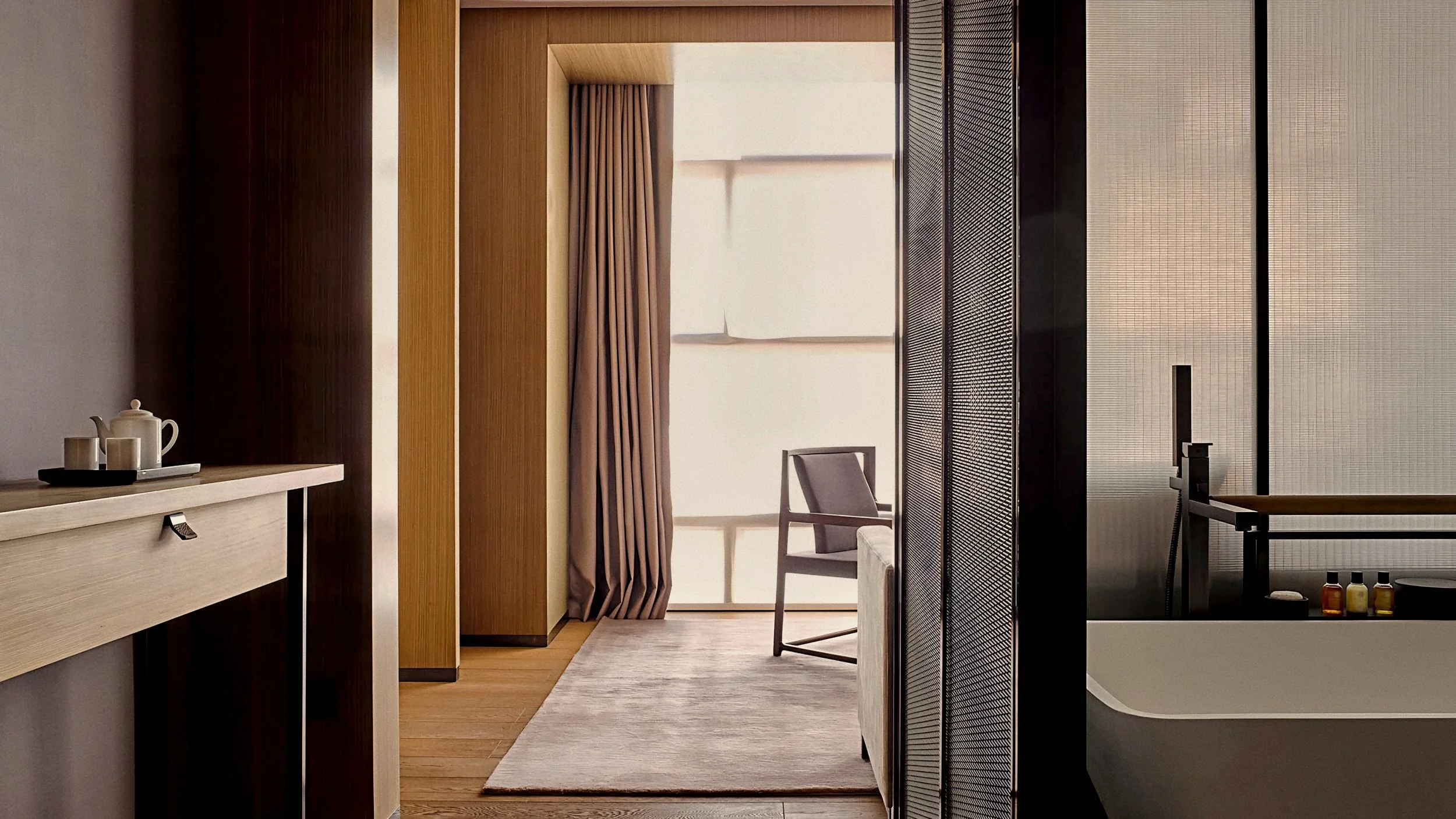 Matte white soaking tub and slatted timber screens At The PuXuan Hotel and Spa in Beijing, China.