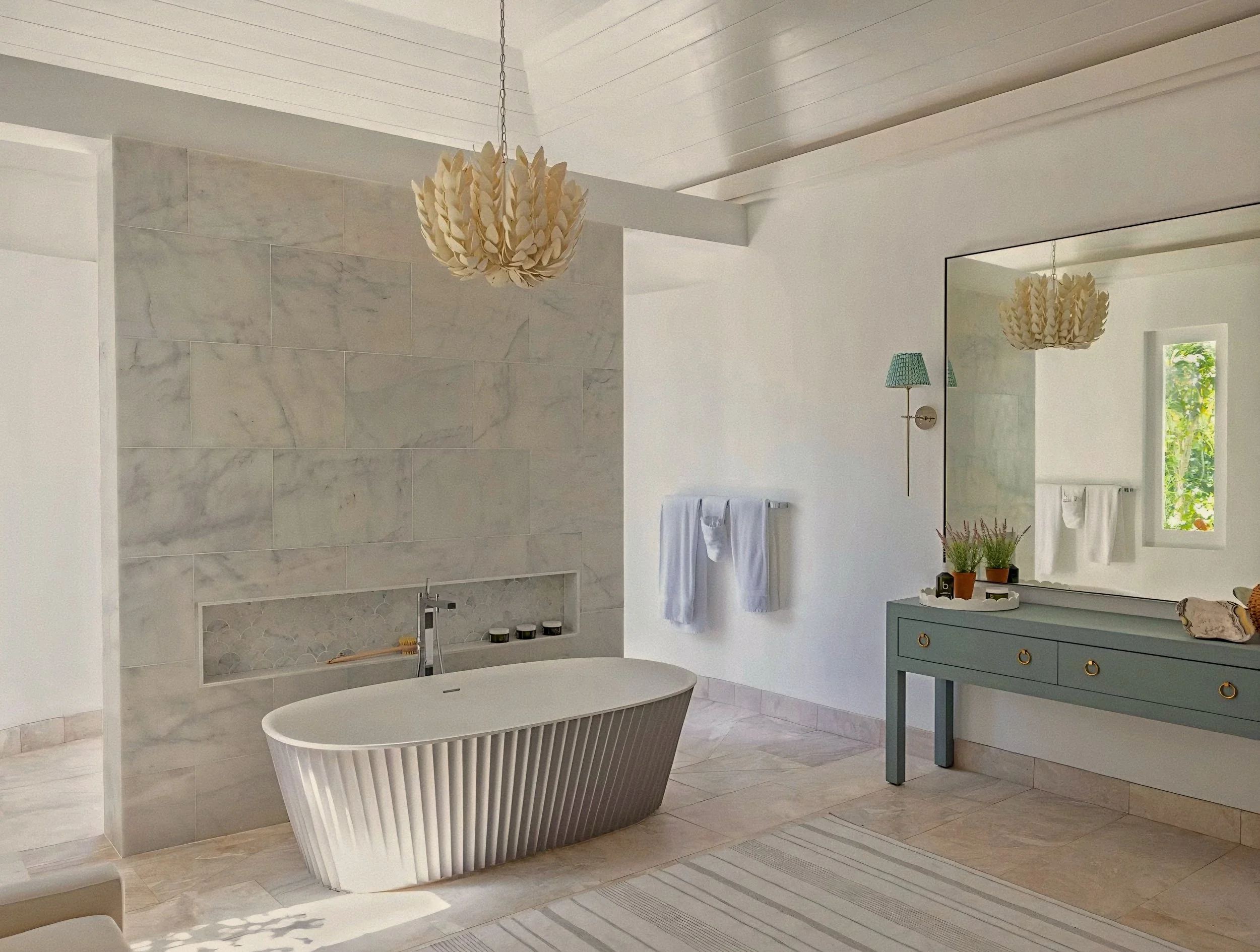 Fluted stone soaking tub in spa sanctuary at Jumby Bay luxury private island, Antigua.