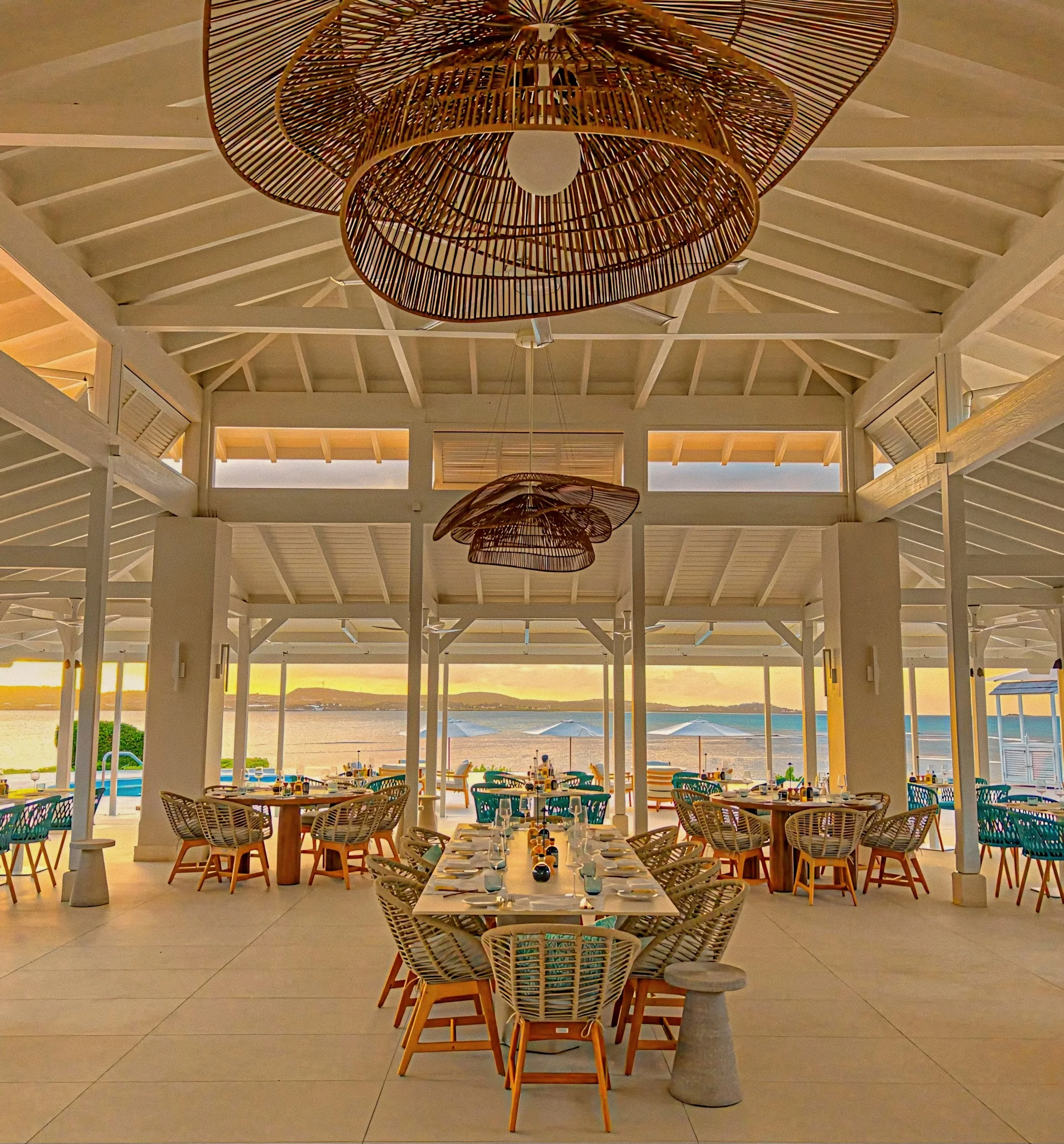 Woven rattan lighting above dining pavilion at Jumby Bay luxury private island, Antigua.