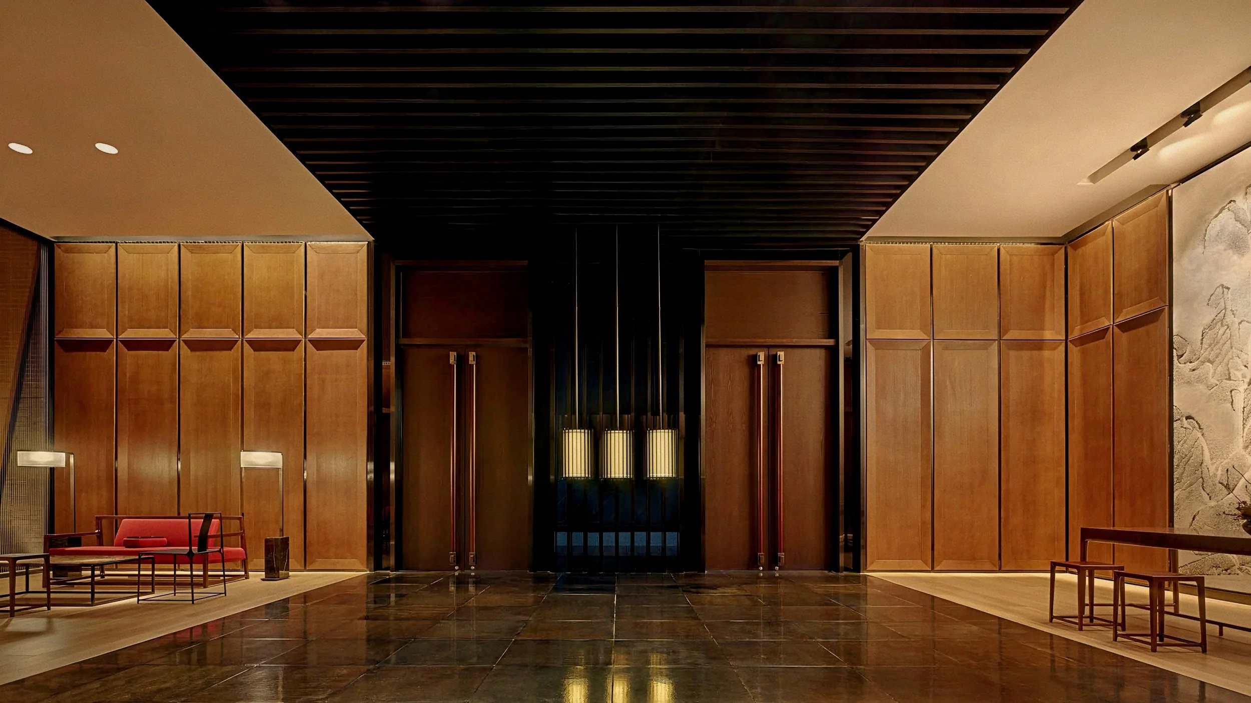 Warm oak paneling and brass lanterns in lobby At The PuXuan Hotel and Spa in Beijing, China.