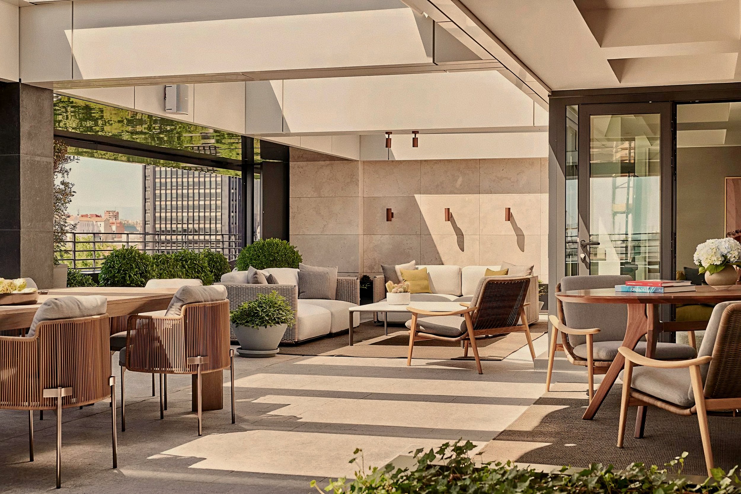 Private penthouse terrace with luxury outdoor furniture at Rosewood Villa Magna Salamanca Madrid Spain.