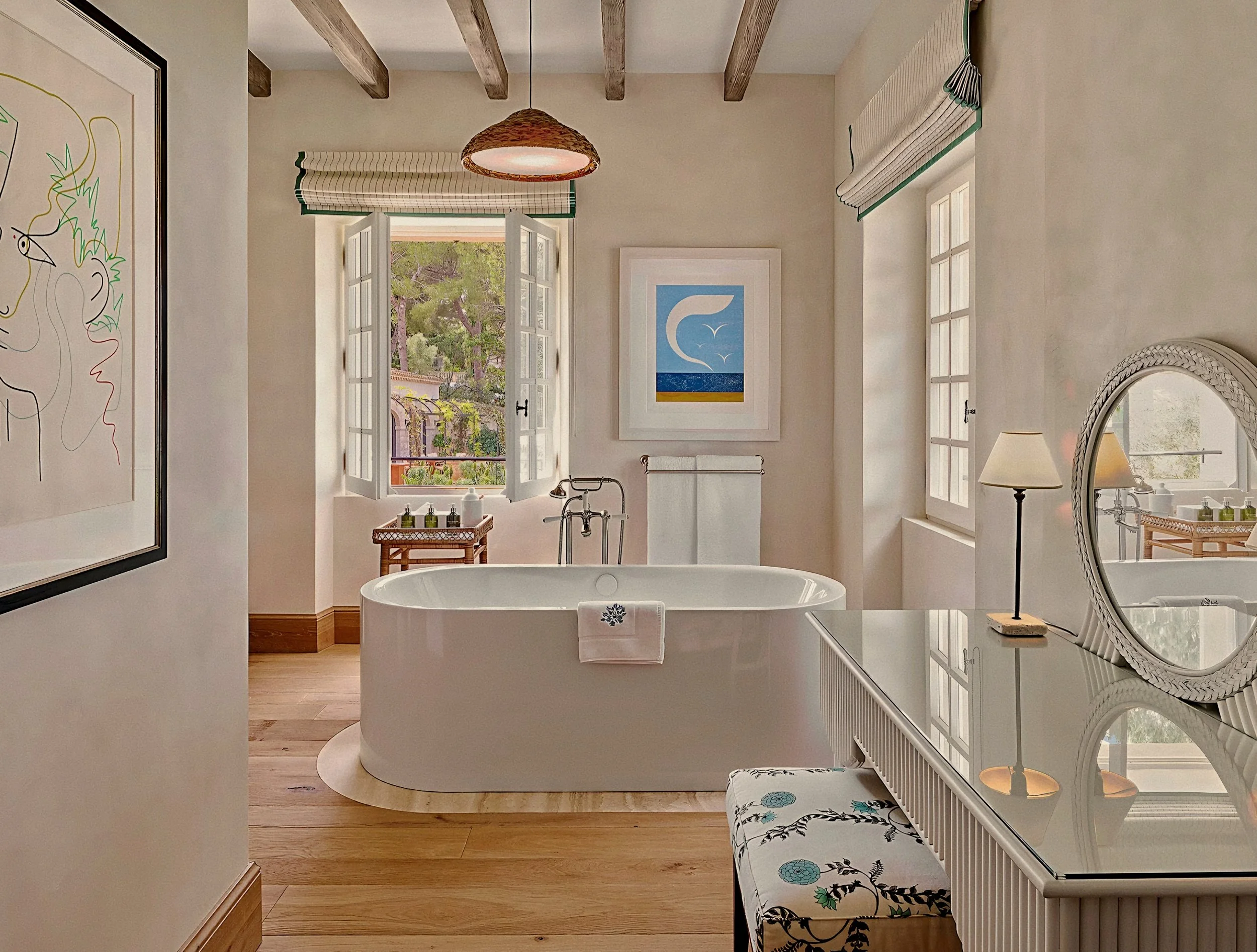 Soaking tub under timber beams inside a luxury suite at Hotel du Cap-Eden-Roc in Antibes, France on the French Riviera.