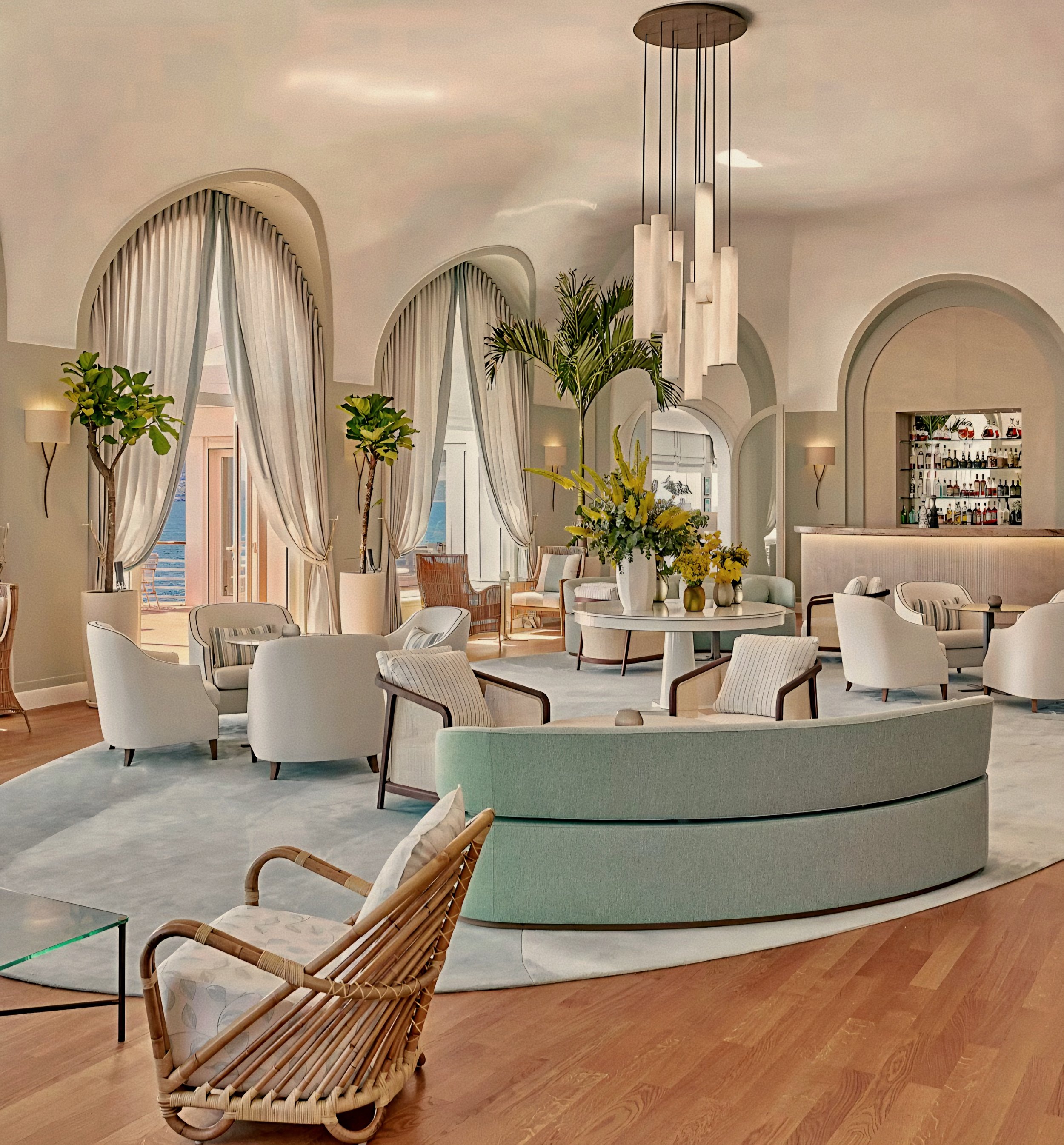 Curved banquette and rattan seating inside La Rotonde Bar at Hotel du Cap-Eden-Roc in Antibes, France French Riviera.