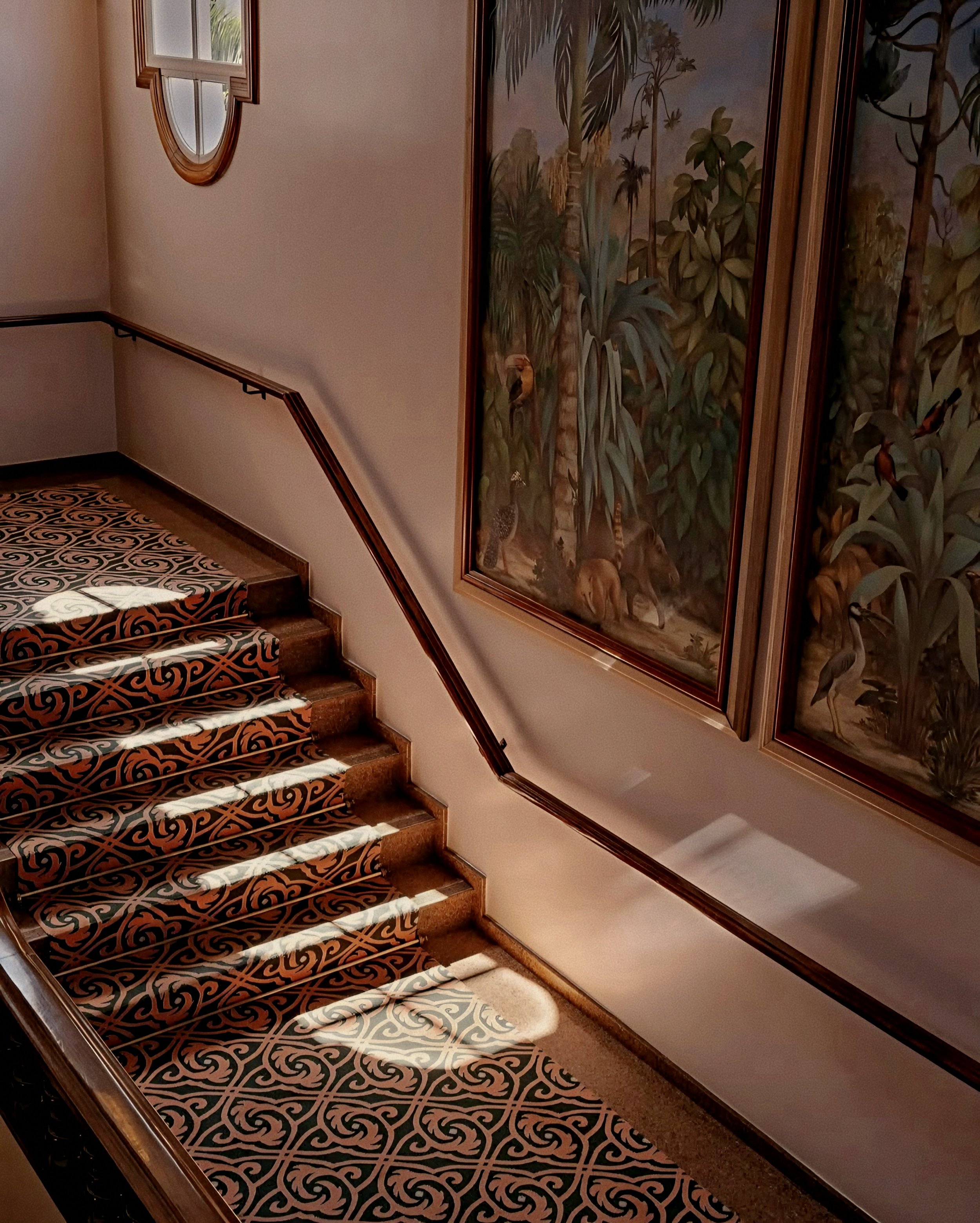 Elegant sunlit staircase interior at Hotel das Cataratas Belmond near Iguassu Falls Brazil.