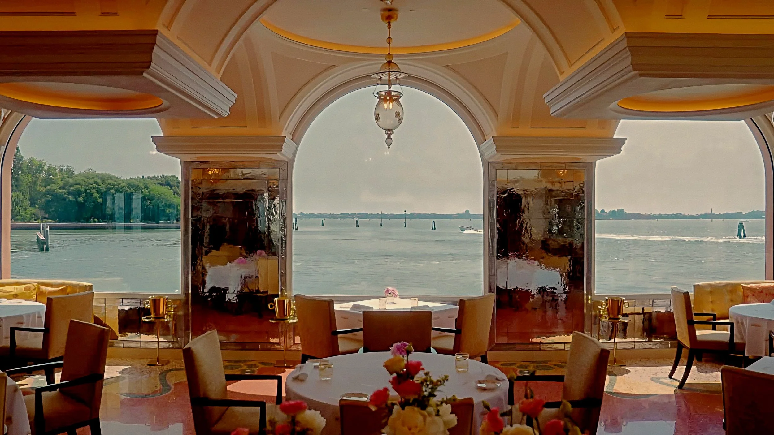 Arched windows with Venetian lagoon view at Oro Michelin-Starred Restaurant Belmond Hotel Cipriani Venice, Italy.