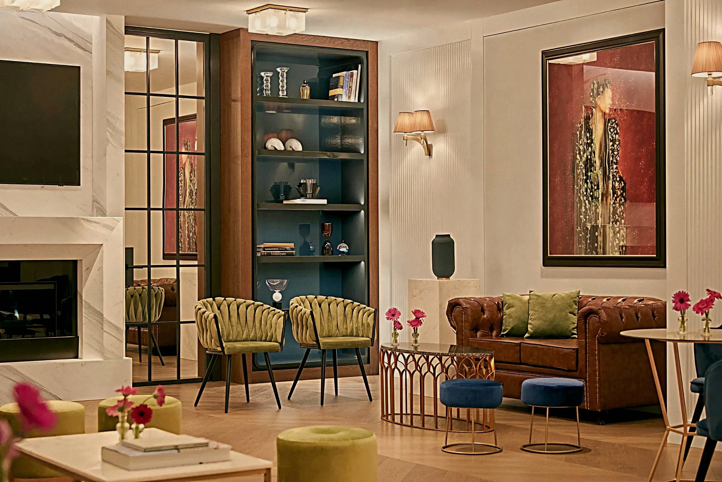 Luxury salon interior at Rosewood Villa Magna in Salamanca Madrid Spain with velvet seating and fireplace.