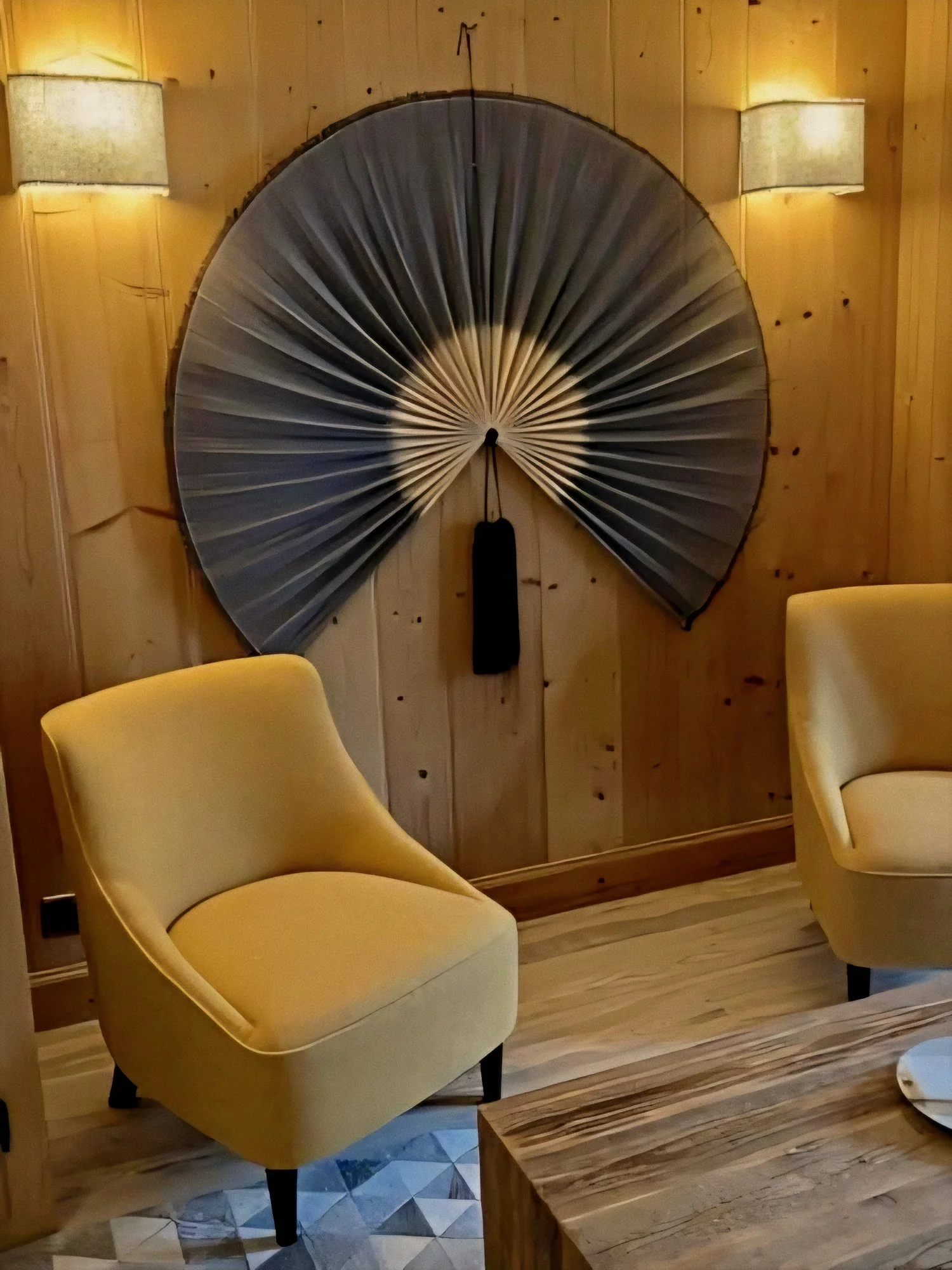 Saffron armchairs and reading nook at Le Chalet d’Adrien Luxury Swiss Alps in Verbier, Valais, Switzerland.