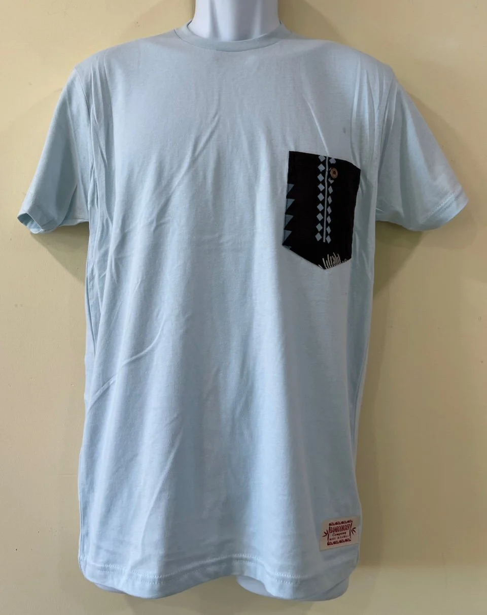 Aleka char on light blue tee