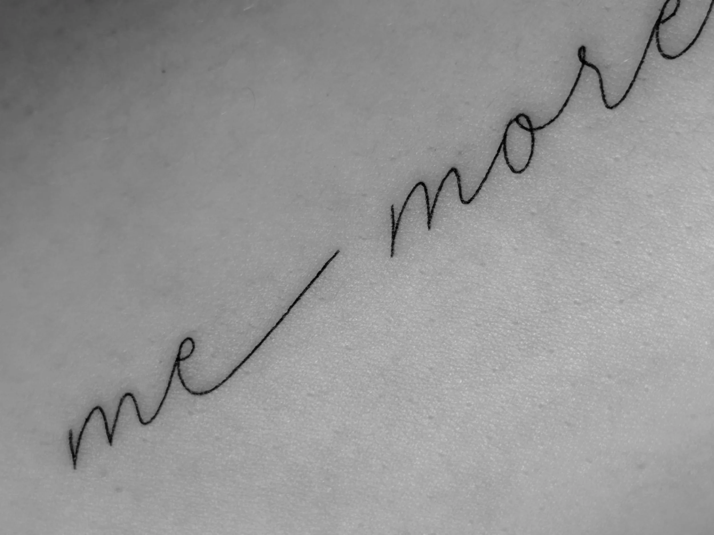 Close-up of a handwritten cursive signature on a piece of paper.