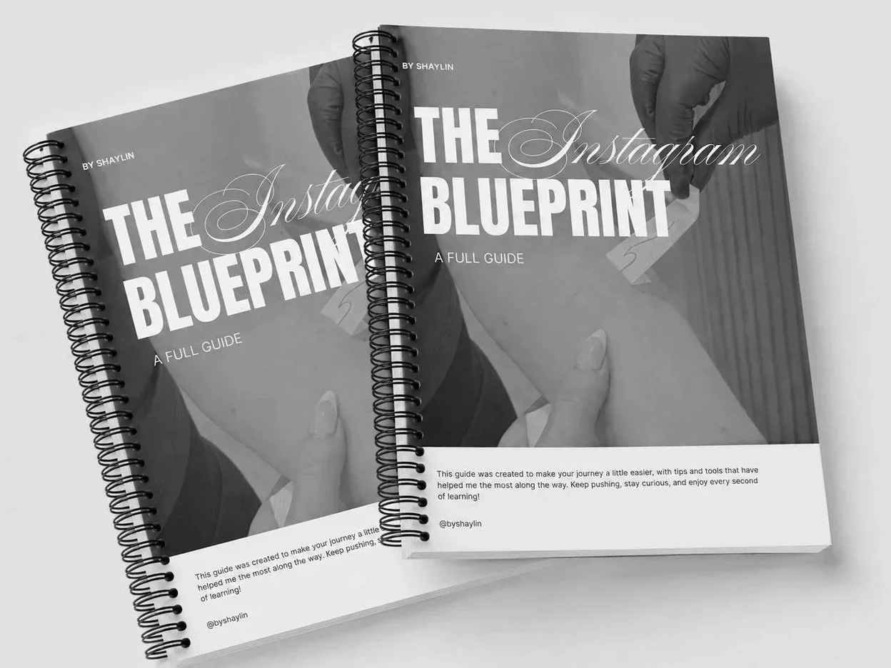Two spiral-bound books titled 'The Instagram Blueprint: A Full Guide' by Shaylin, with a black and white cover showing a person holding a card near their face.