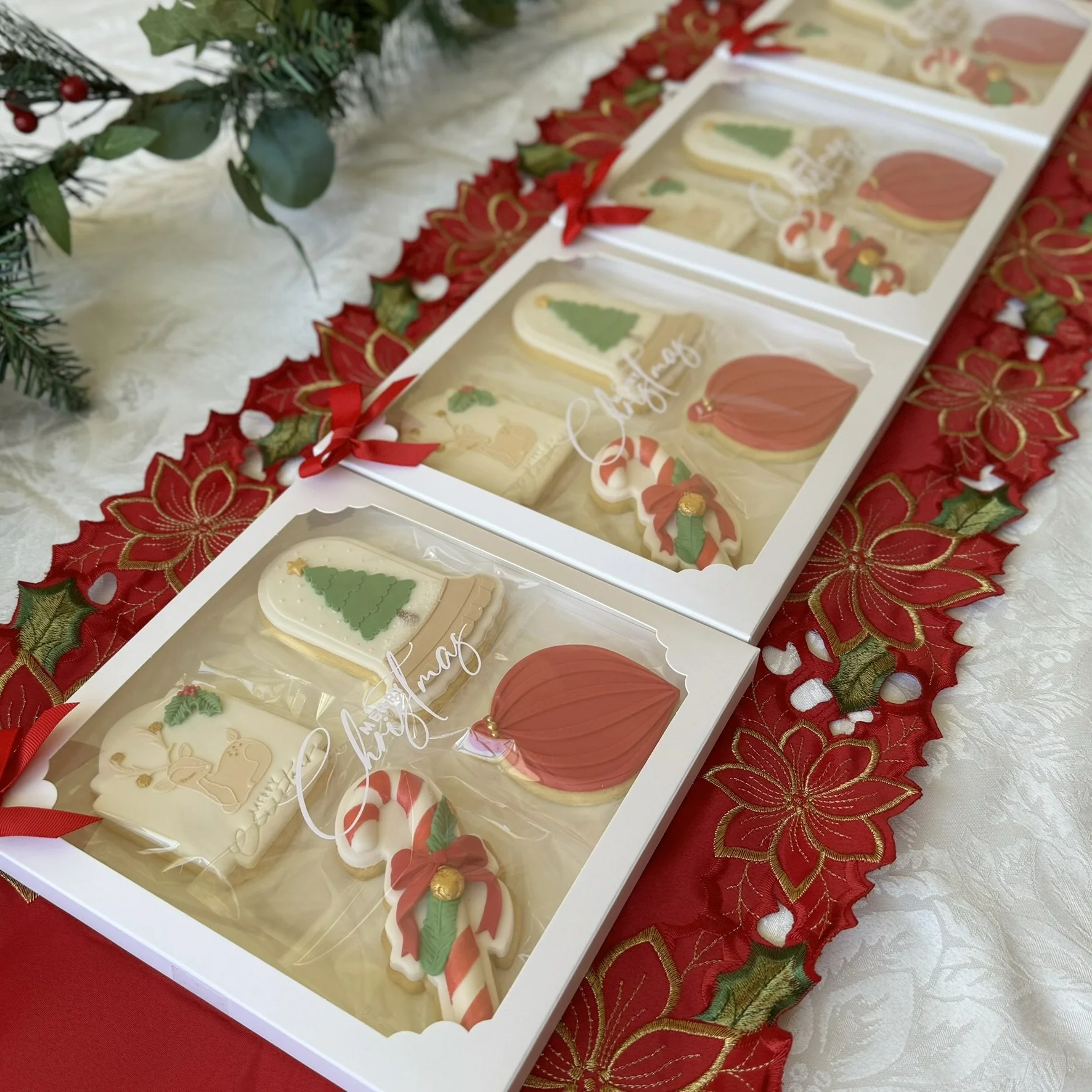 Christmas cookie packs shown on a table setting for gifts